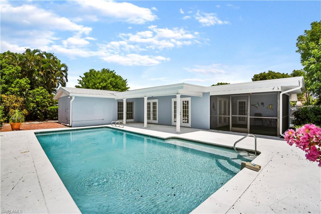 Fantastic pool home in well established Fort Myers neighborhood! One of a kind pool home in the non-gated community of Cypress Lakes Estates w/ a wide drive featuring pavers that has enough room for boat/rv parking, an open front lanai w/ courtyard area, a screened front lanai, over 2,100 sq ft of living under air living space, French door entry to pool lanai, den, family & living room design, split bedroom floor plan, built-in storage in garage, and a spacious kitchen w/ glass doors on built-in cabinetry & a huge pantry area. You will love spending time on the open rear lanai that features a long under truss area, pool, and pavers that wrap around the home on both sides. Great location - close to Barbara B Mann Hall, Florida SouthWestern State College, and just a short drive to the gorgeous beaches of SWFL & the Fort Myers River District.