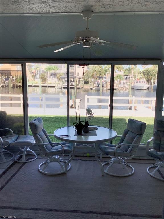 Phenomenal location in Boardwalk Caper! This Boardwalk caper townhome sits directly on the boardwalk and the waterfront. Boat slip #66 is included with the condo and allows you some of the best deep water Gulf access in the area. The spacious townhome features 2 bedrooms and 2 1/2 baths and is perfect for a winter vacation getaway or as a permanent home. 
The community pool and spa is located just a few steps outside of your private fenced outdoor patio. 
Or you may prefer to stay home and enjoy The wildlife and boating activity off of your back lanai. This delightful development also features a 1 mile long boardwalk perfect for morning walks as well as tennis, pickle ball, and even a basketball court. The beautiful white sand beaches of Fort Myers Beach are located approximately 1 mile away. 
Some updating to be expected.