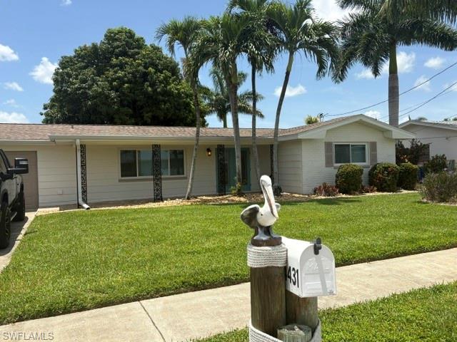 Don't miss your opportunity to own this lovely, UPDATED, 3 bedroom, 2 bath, DIRECT GULF ACCESS home, located in WATERWAY ESTATES which borders Cape Coral and North Ft Myers. WATERWAY ESTATES is a charming neighborhood with NO HOA FEES, has curvey roads with SIDEWALKS and street lighting.  This sturdy, concrete block (CBS) home comes TURNKEY FURNISHED (with a few minor exclusions) offers plenty of natural sunlight throughout & SHOWS LIKE A MODEL. You will love the tiled front porch and the beauty and security offered by the IMPACT RATED, DOUBLE DOOR ENTRY.  This home offers an open concept floor plan, a LARGE KITCHEN ISLAND with QUARTZ counters, SHAKER STYLE cabinets, RECESSED LIGHTING & QUALITY, LUXURY VINYL PLANK flooring throughout.  The master suite features a SHIPLAP accent wall, an attractive barn door to complement the decor, a thoughtful re-design of the master bathroom which features extra shelving with a matching door & hardware and a good size shower.  There's a cozy SUNROOM with hurricane (wind) rated windows and a TONGUE & GROOVE, BEAMED CEILING.  On CITY WATER & SEWER, a WELL FOR IRRIGATION, 16k BOAT LIFT with COMPOSITE DECKING a fenced back yard with PLENTY OF ROOM TO DESIGN YOUR OWN POOL.  Some additional upgrades include: IMPACT WINDOWS IN THE HOME WITH WIND RATED WINDOWS IN THE SUNROOM.  A/C 2017, Roof 2013, Ductwork replaced, 2017.  PUT THIS HOME AT THE TOP OF YOUR MUST SEE LIST - IT WON'T DISSAPOINT!