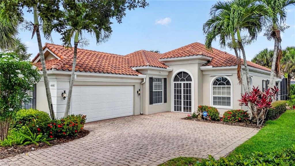 Stunning Oakmont — $1,000,000 Waterfront Views — “Crown Jewel” of Island Walk Models!  
This remodeled ($150,000+/-), furnished (negotiable) 3-bedroom plus den, 3-bath, 2-car side-entry garage pool home shows like a designer showcase. Beautiful tile floors run throughout the main living areas (living room, halls, kitchen, and bathrooms), with rich carpeting in the bedrooms.

The open floor plan features 12' double-crown ceilings and abundant glass windows and sliders. The highly desirable western exposure keeps the home light, bright, and sunny all year long. All windows and sliders are finished with custom Bahama wood shutters.

The chef’s kitchen includes all-wood cabinetry, Level 5 granite countertops, and high-end stainless-steel appliances.

The primary bedroom offers his-and-hers walk-in closets and two completely separate his-and-hers bathrooms, each with tile and glass walk-in showers.

Enjoy the lake view from the large pool in your screened lanai, finished with Keystone/sculptured concrete.

This home has exceptional curb appeal with lush landscaping throughout the front and back yards. The extensive custom landscaping provides outstanding privacy, a rare benefit within the community.

Located near the back gate, the home offers convenient in-and-out access—especially valuable given the size of the community—and is within walking distance of the Town Center.

Low HOA fees include upgraded HD TV, internet service, and a wide range of amenities: two resort-style community pools, eight lighted Har-Tru tennis courts, bocce courts, a beautiful health and wellness center, a staffed full-service restaurant, gas station, hair and nail salon, and post office.

The community is close to the best of Naples, including beaches, restaurants, churches, hospitals, and entertainment. It is only 7 miles from the breathtaking white-sand Gulf beaches.

Come experience resort-style living for yourself!
This home includes a one-year home warranty for total buyer comfort.
This home must be seen!