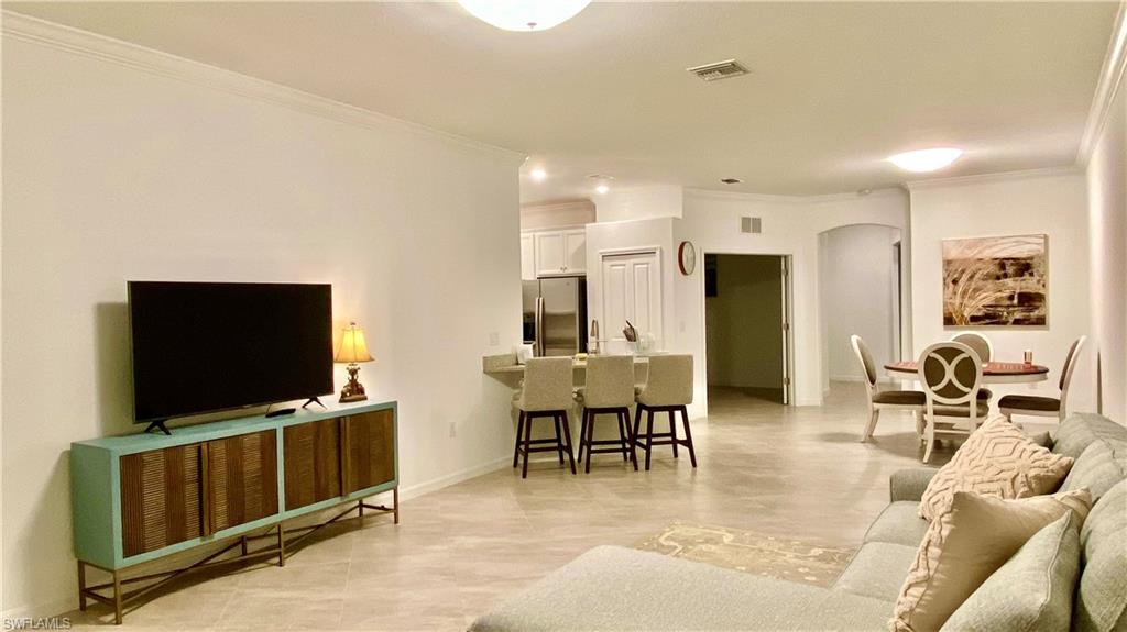 Welcome to this beautifully appointed lakefront villa in the highly sought-after community of Orange Blossom Ranch. Built in 2022, this spacious 2-bedroom, 2-bath residence offers approximately 1,544 square feet of thoughtfully designed living space with soaring ceilings, abundant natural light, and an open-concept floor plan ideal for both everyday living and entertaining.

The home features a generous primary suite, an additional bedroom, a versatile flex space perfect for a home office, and a two-car garage. Large sliding glass doors open to a screened lanai where you can relax and enjoy peaceful lake views and beautiful Florida sunsets.

The well-appointed kitchen flows seamlessly into the living and dining areas, creating a bright and welcoming atmosphere. Whether you're looking for a full-time residence, seasonal retreat, or investment opportunity, this home offers the perfect combination of comfort, style, and convenience.

Residents of Orange Blossom Ranch enjoy an exceptional resort-style lifestyle with two resort pools, spas, a fitness center, a clubhouse, tennis courts, basketball courts, bocce, playgrounds, a splash pad, and an active social calendar. Conveniently located near shopping, dining, entertainment, and top-rated schools, this rapidly growing Naples location provides easy access to everything Southwest Florida has to offer.

Experience modern lakefront living in one of Naples' most desirable amenity-rich communities.