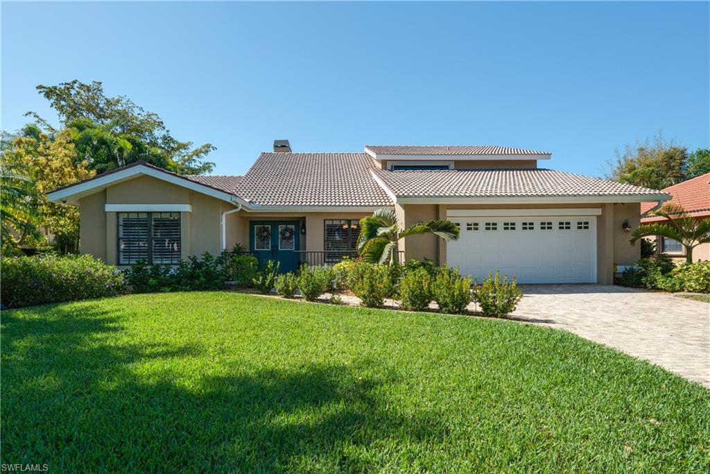 Picture perfect and model home gorgeous best describes this Caloosa Yacht & Racquet Club home! Situated on a quiet street, the paver veranda entrance welcomes you into this 2 story, 3 bedroom + Den, 2.5 bath home featuring a large open, great room with fireplace and French doors to the lanai and pool, formal dining area and a lovely 1st floor master suite! Updates abound from the freshly painted soft color palette to the hardwood floors in the main living areas and bedrooms to newly tiled floors in the kitchen, utility room and baths. The kitchen features 42 inch cabinets, newer black and stainless appliances and neutral Corian counters. New white plantation shutters on all windows and master door wall add a fresh appearance along with new lights and ceiling fans installed throughout the home. A beautiful staircase draws you up to the second floor and 2 guest bedrooms, full bath and a separate loft area. 3 AC units keep you cool in this home including one in the oversized garage! Located in a great community that features a 56 slip marina, a private park and lake, tennis courts, a heated Olympic sized pool and the 4 star Blue Coyote Supper Club this could be your new home!