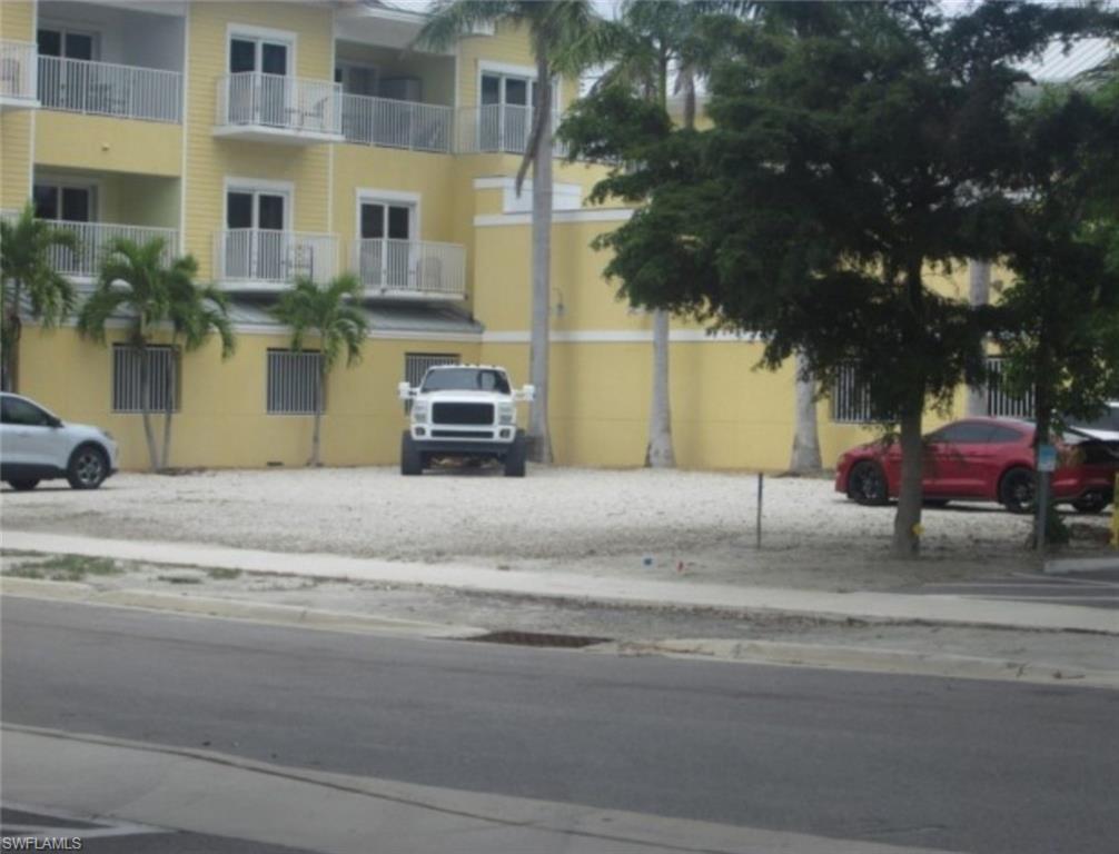 This commercial lot is located in the heart of Time Square adjacent to Harbour House at the Inn on Ft Myers Beach. The downtown commercial zoning will allow for a variety of commercial use. Downtown zoning multi-uses include residential, lodging, office restaurant and retail. The seller has provided a mixed-use concept with commercial on the ground level and 6 - 1 bedroom condo/ hotel rooms on the 2nd & 3rd floor. This is one of the lowest priced properties for development within the high traffic area of Downtown Fort Myers Beach!