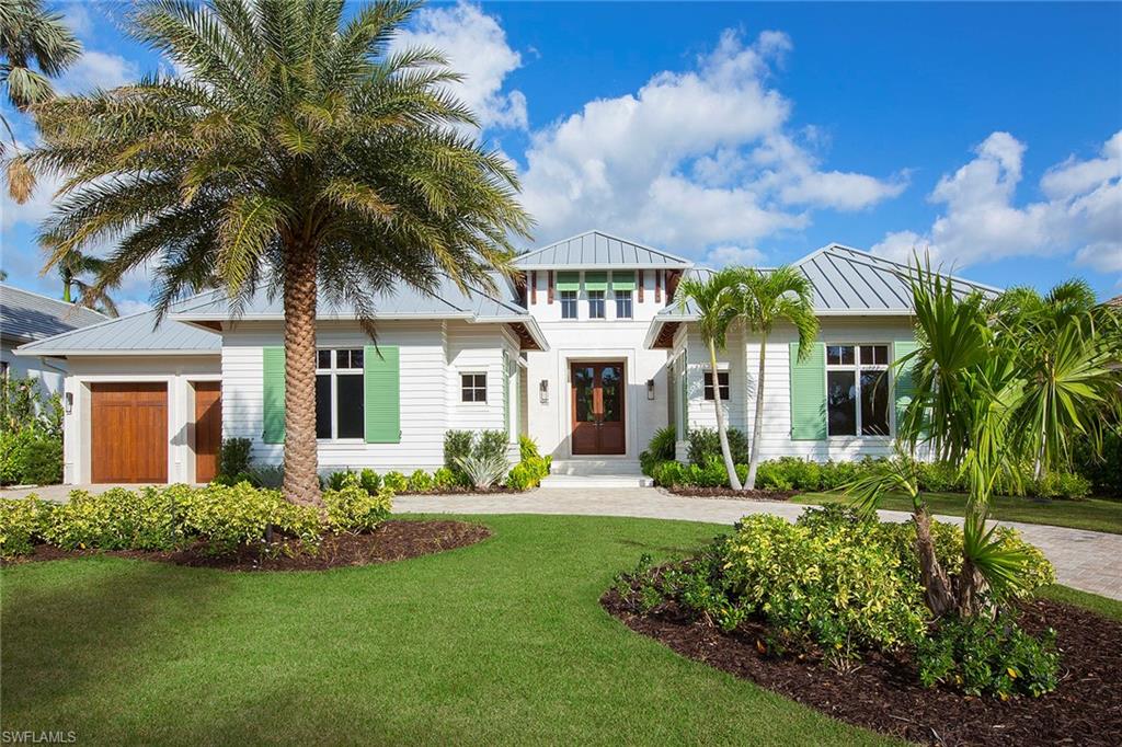 This beautiful single-story home, designed by Stofft Cooney Architects, offers an open concept floor plan allowing for effortless entertaining including a generous indoor and outdoor living space, wine room, and chef's kitchen with double islands. The great room and kitchen open to the patio, which includes a pool, spa, fully-equipped outdoor kitchen, a fireplace, and covered and uncovered seating areas for sunbathing and al fresco dining. The master suite includes spacious separate baths and generous walk-in closets. Four en-suite guest rooms provide privacy and tranquility for your family and friends. This Moorings home couples stunning design with an idyllic location. Residents are eligible for membership to the Moorings private beach park.