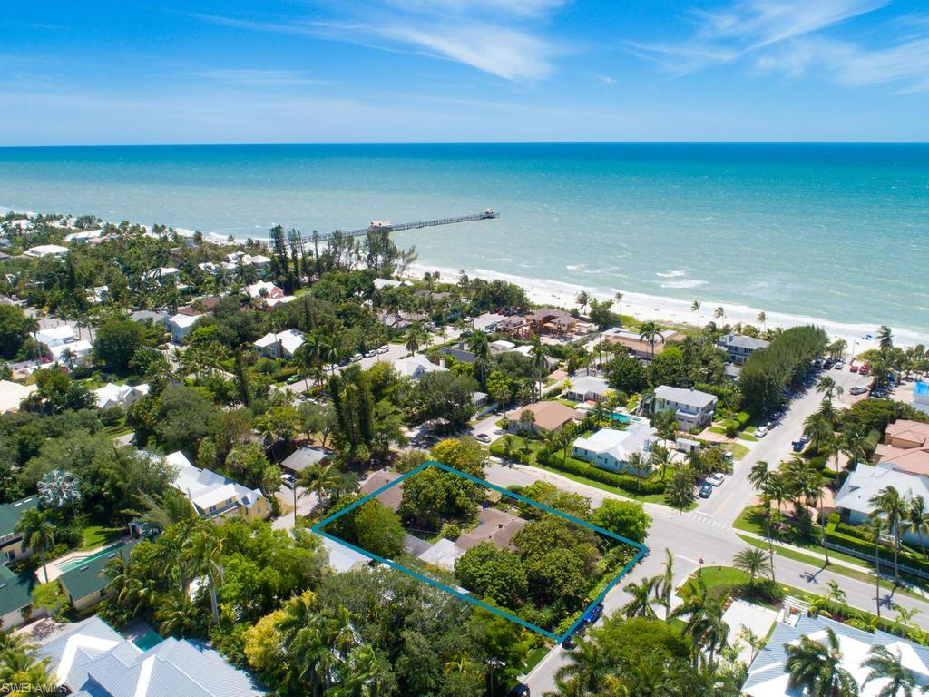 Enjoy the very best of all Naples has to offer. Just 3 homes away from the pristine Naples beaches and only a short stroll to the finest shopping and dinning of historic 3rd Street South.  Property consist of a 3 bedroom main house with approx.square footage of 1437 and 3 bedroom cottage with approx 1122 square footage with carport. This lovely, generous sized, corner lot is bursting with a wide variety of fruit trees. A wonderful opportunity to create your Naples dream home. Property is being sold As-Is.
