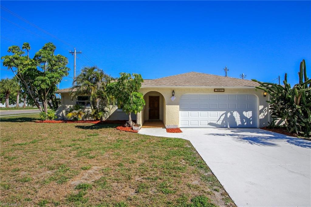 H.12867 - This beautiful 3 bed 2 bathroom home sits on an oversized corner lot and is close to everything that Cape Coral has to offer. It has been TOTALLY refurbished!! Renovated items include a new roof, new low-energy impact windows, new kitchen cabinets and stainless appliances, new bathroom cabinets, plumbing and toilets, new water heater, new in-house washer and dryer, all new tile in the kitchen and living areas and new carpets in the bedrooms. new electrical outlets and switches, a new impact garage door, new garage service door. There are new valves and waterlines, 5 new ceiling fans, new door handles and closet doors, new blinds on all windows, and the interior has been freshly painted. The A/C system was installed in 2015. 
There is a huge screened lanai overlooking the very large back yard. 
You won't find a better home in Cape Coral. Bring your family and enjoy.