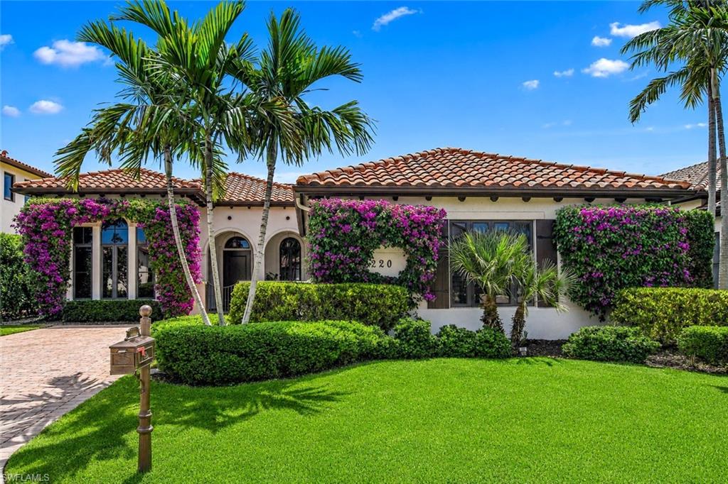 An incredible 3+large den lakefront estate in Grey Oaks, with the opportunity for an IMMEDIATE GOLF MEMBERSHIP, available separately. This residence has been reimagined through an extensive, multi-year renovation. Originally constructed in 2013 to meet modern Florida hurricane standards — including full-impact glass throughout — the home reflects quality craftsmanship, structural integrity, and comfortable livability. A whole-house natural gas generator, a newly applied chemical roof seal (2025), and a tankless hot water system support long-term durability and ease of ownership. Positioned on one of the community’s premier waterfront parcels, the property offers wide, unobstructed lake views framed by an expanded lanai with fewer aluminum bars for cleaner sightlines. The outdoor setting has been updated with a 2025-refinished stone pool deck, a fully upgraded Pentair smart pool system with new pumps, lighting, and equipment, and a complete summer kitchen designed for entertaining. Landscape lighting, new Zoysia turf, and curated privacy plantings enhance the setting. Inside, the home has undergone a comprehensive transformation (2019–2025), featuring a walls-down, open-concept layout that maximizes natural light and indoor-outdoor flow. Polished travertine flooring runs throughout the main living areas, while the kitchen includes Sub-Zero and Wolf appliances, dual under-counter refrigeration, an oversized quartz island, and Hansgrohe fixtures. The primary suite includes a marble walk-in shower, a 9-foot LED mirror, and custom his-and-hers closets. Guest spaces feature custom shutters and updated baths with low-iron glass showers. A climate-controlled two-car garage with an additional golf-cart bay (2025) includes epoxy flooring, custom cabinetry, a workbench, and a hurricane-rated wood garage door. Grey Oaks offers three championship golf courses, two clubhouses, and multiple dining venues. Residents enjoy a 30,000-square-foot wellness center with spa services, tennis, pickleball, and bocce, basketball and dog park.