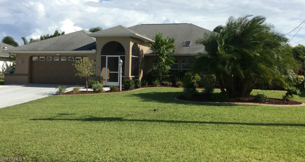 IMMACULATE GULF ACCESS POOL HOME!  This is a must see property!  Pride of home ownership abounds from the moment you enter this home.  This property has it all.... New tile throughout, new granite counter tops and stainless steel appliances, split floor plan with high ceilings and accent shelves, pocket sliders overlooking an over sized lanai with built in bar and pool bath, pool with built in hot tub and a view of the canal and covered boat lift! This property is in a preferred X Flood Zone.  Flood insurance is not required!  These are just a few of the features that make this home so inviting.  The upgrades do not stop there, just too many to list here!  Hurry to make your appointment to see this one today!  It will not last long!