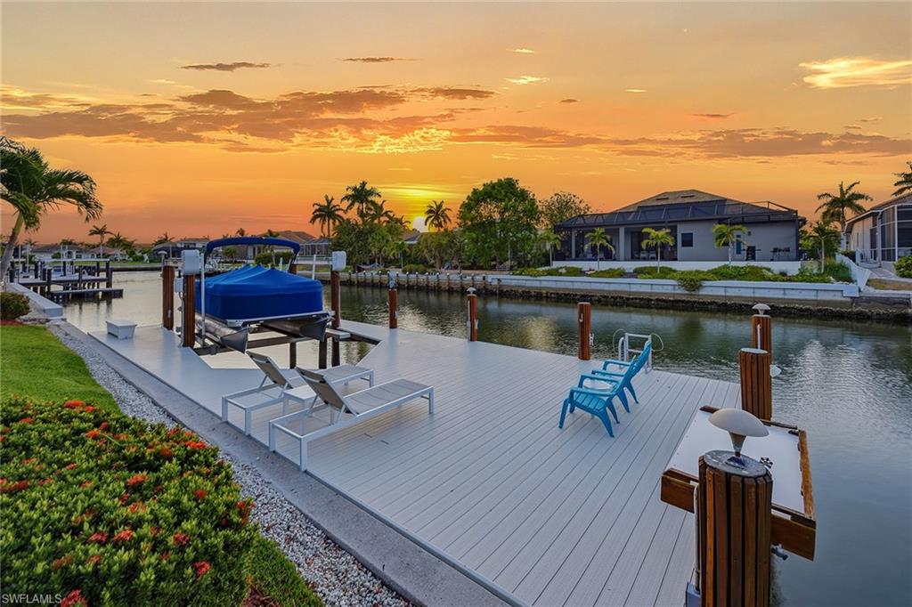 Beautifully maintained, indirect access, J.J. Baker-built home, constructed in 2004. Offering the ideal blend of comfort, space and the laid-back Marco Island lifestyle. Featuring three bedrooms plus a den, two baths and approximately 2,250 square feet of living space. This light and bright residence showcases an inviting floor plan with separate living and family rooms, along with a formal dining room ideal for entertaining. The open kitchen offers stainless steel appliances, a breakfast bar and eat-in dining area that all flow seamlessly into the additional living spaces. Go outside to the expansive screened-lanai featuring a heated pool with water feature, creating a setting for relaxing or entertaining year-round. The large dock with lift provides plenty of room to fish, soak up the sun, enjoy peaceful waterfront views, and an easy idle out to the Marco River and Gulf of Mexico for endless sightseeing, exploring and adventure. The home is in the heart of Marco Island, just moments from area shopping, dining, Publix and Veteran's Community Park where you can enjoy concerts, community events and the beloved seasonal farmers market. This is the ideal opportunity to embrace the Southwest Florida waterfront lifestyle. New air-conditioning system, toilets, electric mirrors and all appliances have been replaced. New roof (2018). Electric hurricane shutters. Hardwood floors bedrooms and study. Custom closets throughout.