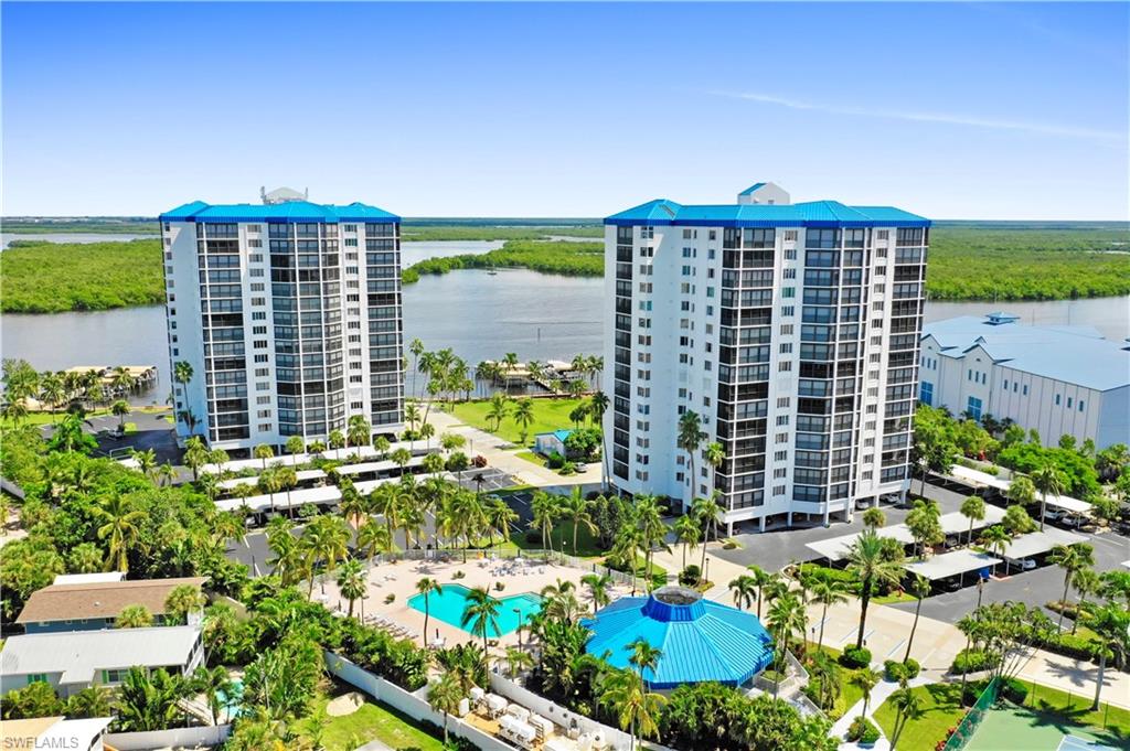 Special financing is available for this property! Beautifully furnished 2 bedroom, 2 bathroom Ocean Harbor condominium offers spectacular Gulf views from sunrise to sunset! This 5th floor corner unit is filled with natural sunlight & offers many lifestyle conveniences with the large open concept living space, oversized screened balcony, dining area, 1 covered parking space, & electric hurricane shutters. The home has been meticulously maintained & includes a NEW A/C, NEW interior paint, upgraded LED can lighting, newer washer & refrigerator, along with an upgraded water heater.  The master suite offers relaxing views of the Gulf, large master bathroom, walk-in closet & a private entrance to the lanai. The 2nd bedroom is ideally used as an office/guest suite with the convenience of a built in desk & hideaway bed. This gated community offers fantastic resort-style amenities, & a spacious floor plan right in the heart of Fort Myers 
with beautifully maintained grounds, organized social events, amazing beach access through Newton Beach with restroom facilities, resort-style pool, tennis courts with pickleball, clubhouse, fitness center, marina, & private access to Publix supermarket.