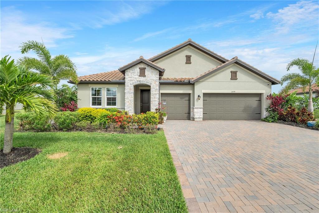 Welcome to 2078 Grove Drive, a beautifully upgraded Naples residence where luxury, efficiency, and Florida lifestyle come together seamlessly. This exceptional property has undergone approximately $200,000 in improvements, creating a move-in-ready retreat designed for both comfort and peace of mind.
The home features a premium solar energy system with two Tesla Power wall, providing enhanced energy independence and long-term savings. An EV charging outlet has been installed in the garage, making the property future-ready for electric vehicle owners.
Outdoor living is elevated by a resurfaced pool and upgraded premium pool deck, creating the perfect setting for entertaining or relaxing in the Florida sunshine. The property is further enhanced by impact-resistant windows and hurricane screens, offering superior storm protection and security.
Lush tropical landscaping showcases an array of fruit trees, flowering plants, and mature greenery, creating a private backyard oasis. Inside, the home features custom interior paint throughout and an updated custom master closet, adding style and functionality to the living spaces.
Located within a highly desirable Naples community, residents enjoy the benefit of exceptionally low HOA fees—among the lowest available for a community of this caliber—helping keep ownership costs down without sacrificing location or lifestyle.
This is a rare opportunity to own a thoughtfully upgraded Naples home that combines luxury finishes, energy efficiency, storm protection, and exceptional outdoor living—all in one remarkable property.

Highlights Include:

EV charging outlet in garage
Resurfaced pool and upgraded pool deck
Impact-resistant windows
Hurricane screens
Tropical landscaping with fruit trees and flowers
Custom interior painting throughout
Updated custom master closet
Exceptionally low HOA fees

Experience the best of Naples living in a home where every major improvement has already been completed for you. Luxury, efficiency, and value rarely come together this effortlessly.