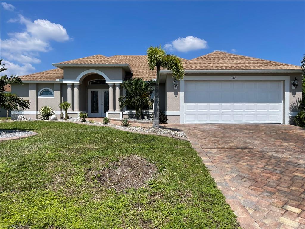 This beautiful home in NE Cape Coral sits on a peaceful freshwater canal in a nice, quiet neighborhood, while only minutes away from many of the towns shops and restaurants.
The property is 3 bedroom/2 bathroom/2 car garage with tile throughout the entire home, granite kitchen countertops, painted plywood cabinets with soft-close doors and drawers, stainless steel kitchen appliances, and a laundry room with cabinets and washer/dryer hookups.
Storage can be found all throughout the home with both guest rooms having bi-folds, two walk-in master room closets, laundry and bathroom storage, hallway closet, and additional shelving in the garage. 
Both bathrooms feature tiled walk-in showers, with the master bathroom having a jet bathtub and an over-sized shower with two entry points.
On the outside, the driveway and walkway going to the front door are paved. There is a screened-in lanai out back that overlooks the large backyard and canal and can be accessed via sliding doors located in either the living room or master bedroom. The property already includes a seawall with a concrete dock and fishing pole holders to get South Florida living started right away! Schedule a tour today!