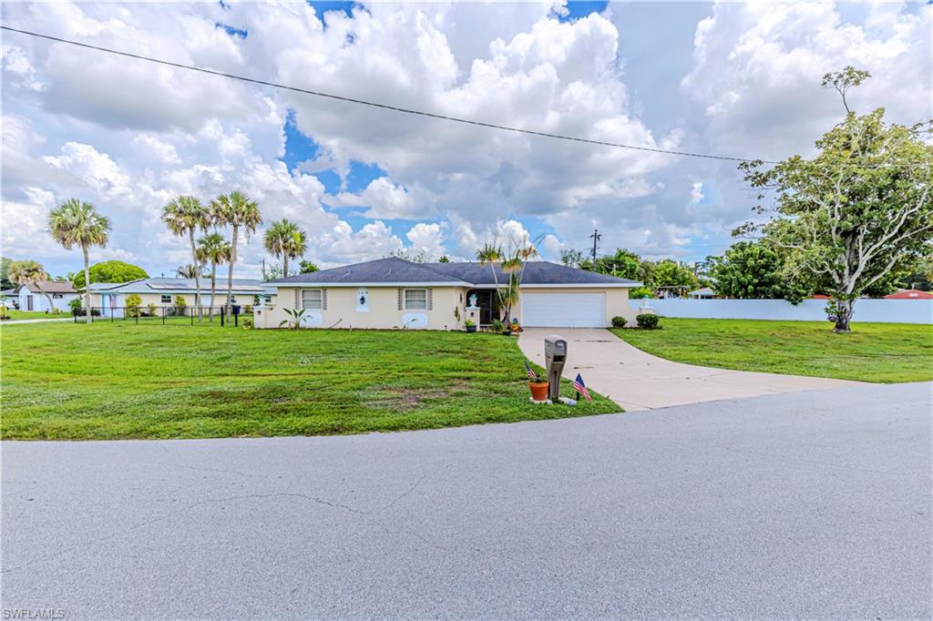 Located in the desirable Country Club area of Lehigh Acres, this 3 bedroom, 2 bathroom pool home sits on an oversized corner lot and offers plenty of potential for its next owner. Inside, you’ll find neutral paint throughout, plantation shutters, ceramic tile and wood laminate flooring, and a functional layout designed for everyday living. The kitchen features stainless steel appliances, while the oversized garage provides ample space for vehicles, storage, or a workshop.

Step outside to enjoy the screened pool and spacious backyard, offering plenty of room to relax, entertain, or create your own outdoor oasis. This home is a great opportunity for buyers looking for a pool home in an established neighborhood who don’t mind adding a few personal touches to make it their own. Conveniently located near shopping, dining, schools, and major roadways, this property combines location, space, and value.