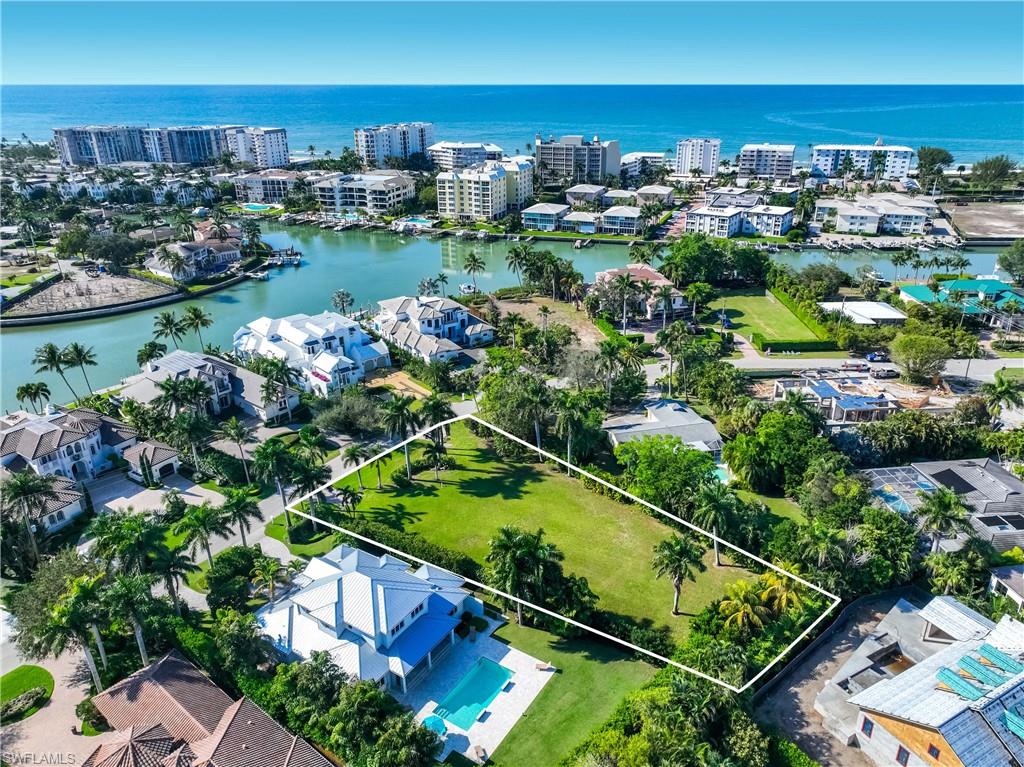 Located within the City Limits of Naples, this .50 Acre Landscaped Lot is the largest available on the market in the Moorings, Coquina Sands or Parkshore.  Located west of Crayton Rd on Beautiful Spring Line Drive this lot is only a 3–4-minute bicycle ride to Moorings Private Beach and the Gulf of America.  Currently, there are irrigation lines run throughout this lot which is why the grass and Royal Palm Trees are so lush.

A fence is located on the eastside and northside lot lines of this property.  Just add one on the westside and you will 
have the ability to close off the backyard for a future home.