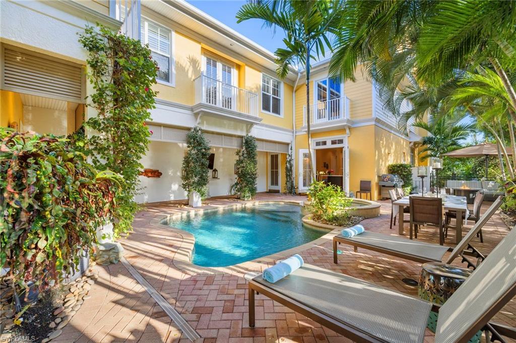 Rare to be sure! Located on a gorgeous quiet street 1 block off 5th Avenue South so all dining & shops are steps away. 3 blocks to the beach for evening sunset strolls. Relax with your own private super spacious heated pool / spa area & inviting firepit area too. 3 bedrooms plus bonus room & 4.5 baths or 4 bedrooms and 4.5 baths, private elevator, private 2-car garage off alley. This corner residence lives like a home yet this lovely low density condominium of only 5 total residences brings you the freedom to go play golf, shop, travel, dine! Designed so there is no one above you & no one below you. The best of the best plus this residence is located at the west end so you have plentiful windows, light & privacy. Gorgeous quintessential Florida architecture in one of the most ideal locations in Olde Naples. Live all the reasons that make Olde Naples SO spectacular! High ceilings, kitchen renovated with new cabinets / surfaces & new Thermador appliances, expanded pool area with pavers & spindled fencing, renovated master suite & bath, renovated living room & bar area, resurfaced pool & spa surfaces with pebble-tech, all 3 zones of air conditioning equipment replaced 2018. Enjoy!
