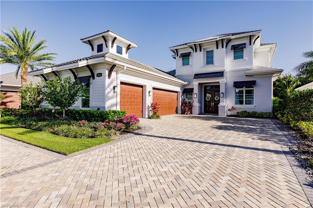 Fully furnished, upgraded Grenada I Former Model Home by Seagate Development Group with interior design by Clive Daniel.  A spacious great room, dining area, kitchen, study with a walk-in closet, master suite, & guest suite on the first floor. Two upstairs bedrooms and a game room offer an area for studying & entertaining. The home features 4 full baths and 2-half baths, a 3 car garage, a large covered lanai with remote roll down screens and hurricane shutters, exquisite fireplace & outdoor kitchen along with a pool & spa. Other features include a buried 500 gallon propane tank, gas cooktop, custom 10' mahogany front door with transom, double pane Andersen impact windows & doors, 10’ tall WinDoor pocket sliding glass door, Bosch appliances, Kohler plumbing fixtures, custom Smithport Cabinets, granite/quartz counters, frameless shower enclosures, free standing tub in master, custom closet systems, premium wood baseboards, premium window & door casing, solid 1¾” Timberland interior doors, Emtek interior door hardware, 4" recessed LED lighting throughout every room, Control 4 home automation system, spray foam insulation, sound insulation in bathrooms and laundry, and level 5 drywall.