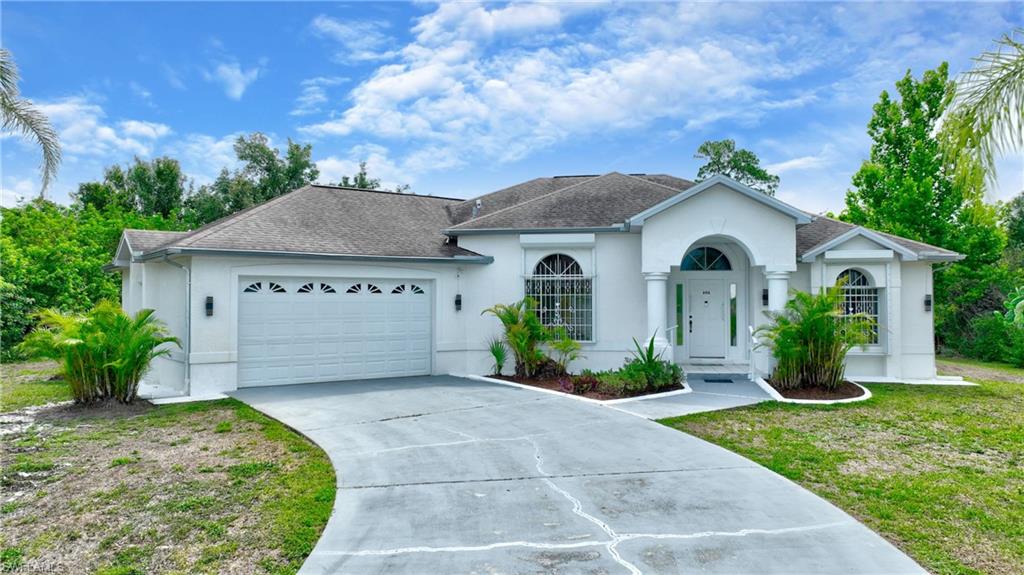 This property offers the perfect blend of comfort, privacy, and Florida lifestyle living. This beautifully maintained 3-bedroom, 2-bath POOL home sits on a half-acre lot surrounded by mature landscaping, giving you the space and serenity that’s increasingly rare in Lehigh Acres. Step inside to an inviting layout, tile floors throughout the bright living spaces and a seamless flow toward the home’s standout feature — a sparkling inground pool framed by an expansive, private deck ideal for entertaining, relaxing, or soaking up the sunshine. The oversized lot provides room to breathe, garden, play, or simply enjoy the peaceful setting. Located on a quiet street yet just minutes from shopping, parks, and schools, this home delivers both convenience and tranquility. Whether you're looking for a family home, a winter retreat, or a private oasis, this property checks all the boxes.