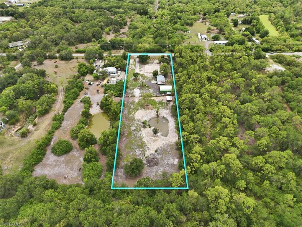 Rare opportunity to own 2.5 acres of build-ready land directly across from the rapidly growing Babcock Ranch community in Punta Gorda. This beautiful property offers a newly installed perimeter fence, a private lake, existing septic system, and access to electricity, providing a head start on your future home or investment project. The parcel is not located within wetlands, offering greater flexibility for development and peace of mind. Enjoy the privacy and space of country living while remaining close to shopping, dining, recreation, and all the conveniences of the area's continued growth. Don't miss your chance to secure acreage in one of Southwest Florida's most sought-after emerging locations.