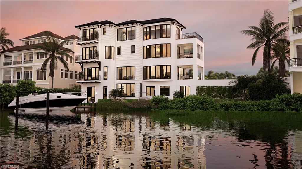 One or more photo(s) has been virtually staged, AI generated or rendered.  RARE OPPORTUNITY! Price is for vacant land only—however the property plans for a state-of-the-art luxury estate by the highly regarded Kukk Architecture & Design are available for purchase. This beautiful home would feature 4,597 sq ft under air with 4 bedrooms including a VIP suite, den, cloud room, 4.5 bathrooms, elevator, 4 car garage, and an elevated pool. This spectacular lot is located in the double-gated “Bayfront” neighborhood of Collier County’s premier “Barefoot Beach” community. This blank canvas offers unparalleled 
opportunity for your dream home with a boat dock, boat lift, highly-sought after western exposure for breathtaking sunsets, long bay views & possible Gulf views from the upper floors of your future coastal haven. Appraisal available, priced under appraised value. Located steps to the sugar sand of Barefoot Beach and only a 15-minute boat ride to the Gulf of Mexico, this lot is a beach and boater’s delight! Bayfront Dr. homes 
are built on one side of the street, providing homeowners optimal privacy & views of the Bay. The OPTIONAL in-community “Club at Barefoot” offers tennis, 2 restaurants, beachside food/bev/chair service & activities. Nearby to fine dining & easy access to RSW Airport, Mercato & Waterside Shops. Only 15 miles to Naples 5th Avenue. This is your chance to craft the perfect home on the tranquil bayfront of Barefoot Beach.