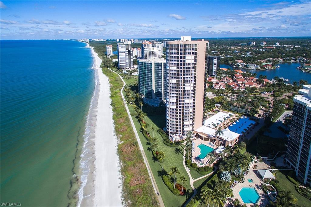 This landmark beachfront estate captures Naples' ultimate 360-degree views. There is only one estate per floor with 28 total residences. This is a spacious, architectural masterpiece encompassing approximately 6,800 square feet, featuring dramatic floor-to-ceiling glass boasting dynamic Gulf, coastal and bay views from sunrise to sunset. There are sensational living areas including an expansive great room, family room, gourmet kitchen and spectacular library with fireplace. The master suite is nestled directly on the beach, in addition to three guest suites. Additional offerings include secured elevator entry and a two-car garage. This residence offers the ultimate in privacy, utmost in security and first-class amenities.