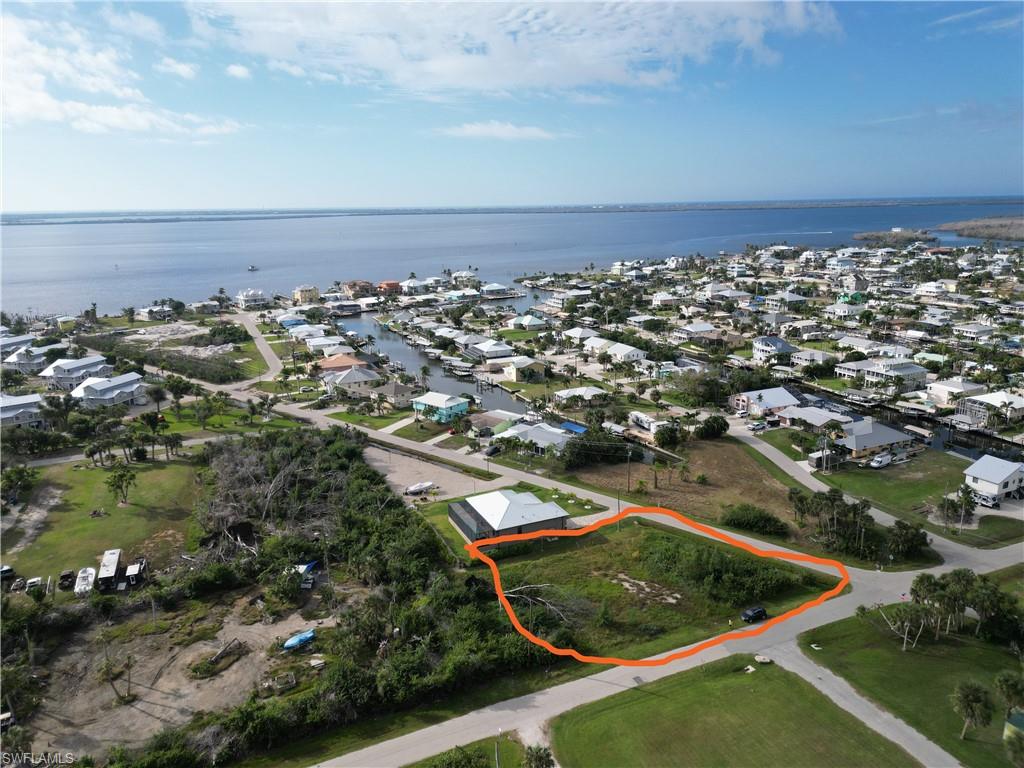 Oversized rare prime residential lot near the heart of Saint James City, a laid-back boating/waterfront community located on the southern tip of Pine Island in Lee County, Florida. Quiet neighborhood near a pocket park. Lot is mostly cleared. Elevation approx. AE-EL8 (NAVD88). Water available.  $4,773.00 utility connection fee. Dimensions of parcel: 112 x 174 x 102 x 130 .   
Parcel Info
https://share.google/5gVvAKVThSuUWQJNe
Zoning Info 
https://share.google/b78s69VIEbgpJpCui