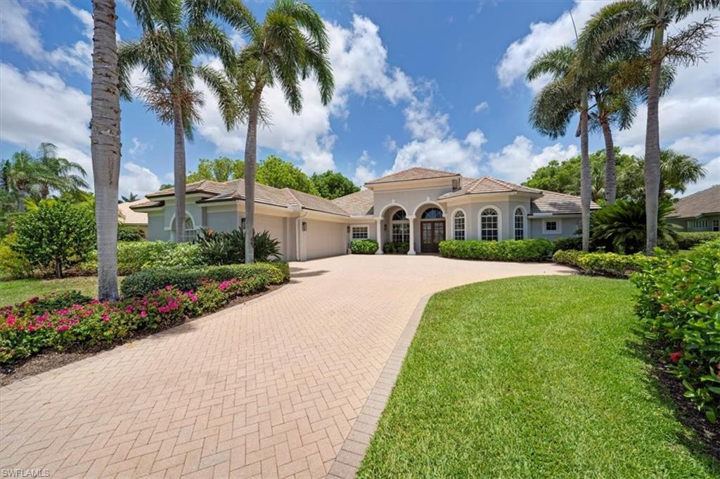 IMMEDIATE GOLF MEMBERSHIP. This property can be sold with or without the golf membership. Stunning wide open Panoramic Lake & Fairway Views for this Estate Home in Grey Oaks. Experience timeless elegance and effortless Florida living at 2366 Alexander Palm Drive, located within the prestigious and award-winning Grey Oaks Country Club in beautiful Naples, Florida. This estate residence offers immediate golf membership eligibility, a rare and coveted opportunity for golf enthusiasts eager to enjoy one of the region’s most acclaimed championship courses. Situated on a prime lot with unobstructed views of the Palm Course and expansive, long lake vistas, the home’s setting provides a serene backdrop for year-round enjoyment and elegant entertaining. Soaring ceilings and sunlit interiors create a warm and open atmosphere, while refined architectural details enhance the home’s timeless appeal. The thoughtfully designed layout features four bedrooms, three and a half baths, and a large executive office with custom built-in cabinetry and a floating desk—perfect for working remotely in comfort and style. The updated kitchen boasts modern quartz countertops, newer appliances, and a spacious layout ideal for everyday living or hosting. Enjoy peace of mind and comfort with major improvements already in place: a newer roof (2022), air conditioning systems (2019), electronic screens, and hurricane shutters on the lanai for added security. The resort-style pool area includes a new pergola with a gas fireplace—an inviting space for relaxing evenings or entertaining guests under the stars. Additional features include a true three-car garage with room for a golf cart, offering both convenience and ample storage. Don’t miss this exceptional opportunity to own a move-in ready home in one of Naples’ most sought-after luxury communities. Live the lifestyle you deserve in Grey Oaks Country Club.