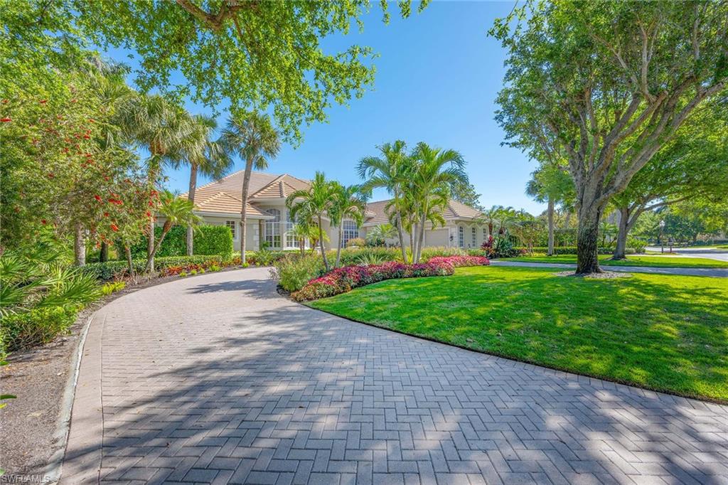 Wide-water and golf course views complement this lovely custom-built residence in the award-winning Grey Oaks Country Club. This home features a new roof, replaced air-conditioning systems, water heaters, front door, family room glass sliders and outdoor pool fencing, along with remodeled main bath and pool/guest bath, kitchen and den. A circular driveway leads to double-door entry which opens to a marble-tiled foyer and impressive gallery which spans the length of the home. There is also a service driveway to a spacious three-bay garage. Wide picture windows throughout the residence bring in sunlight and display beautiful panoramic views. The main suite comprises the entire east side of the house and features two full baths with separate water closets, marble vanities, dressing areas, walk-in closets, and mutual walk-in shower and onyx Roman tub. The private guest wing features two generous en-suite bedrooms with walk-in closets. For those who love to cook, the gourmet kitchen is fully equipped for prepping and creating. When it’s time to entertain or just relax, the gathering room with a fireplace and expansive lanai with over-sized free-form pool and Jacuzzi will provide endless enjoyment. Grey Oaks has state-of-the-art amenities including the 30,000-square-foot-plus wellness center and spa, three championship golf courses, pickleball, tennis, casual and fine dining venues. Old Naples, private and international airports are easily accessible.