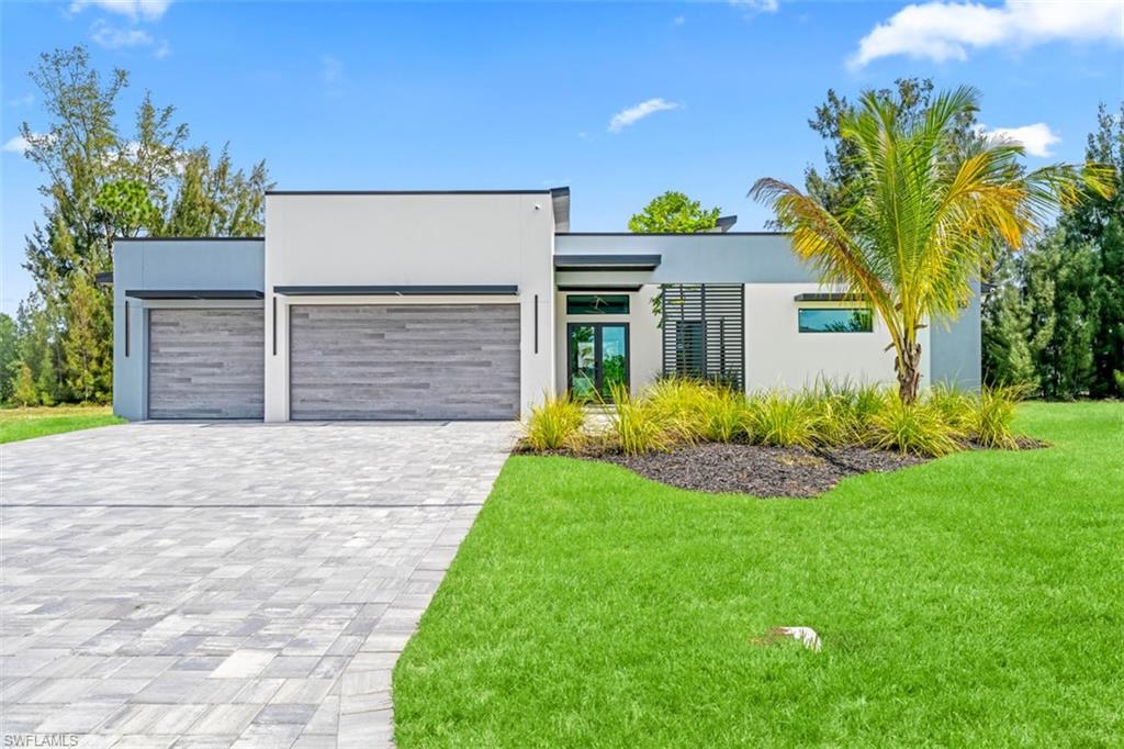 Experience modern luxury waterfront living in this stunning new-construction home situated on a desirable freshwater canal. Offering 3 bedrooms plus a den, 3 full bathrooms, and a spacious open-concept design, this residence combines elegance, comfort, and functionality.

The home features a durable metal roof, soaring ceilings, premium finishes, impact-resistant windows and doors, a security alarm system, and a gourmet kitchen equipped with high-end JennAir stainless steel appliances, custom cabinetry, and an oversized island perfect for entertaining.

The owner’s suite serves as a private retreat with a spa-inspired bathroom and generous walk-in closets. Step outside to your fully fenced backyard oasis, featuring a sparkling pool, a relaxing spa, a covered lanai, and serene freshwater canal views, offering privacy and the perfect setting for outdoor enjoyment.

Additional highlights include a spacious garage, paver driveway, professionally designed landscaping, premium craftsmanship throughout, and enhanced security features. Enjoy the tranquility of waterfront living while remaining conveniently close to shopping, dining, schools, and all that Southwest Florida has to offer.

A rare opportunity to own a modern waterfront masterpiece that perfectly blends luxury, privacy, and the Florida lifestyle.