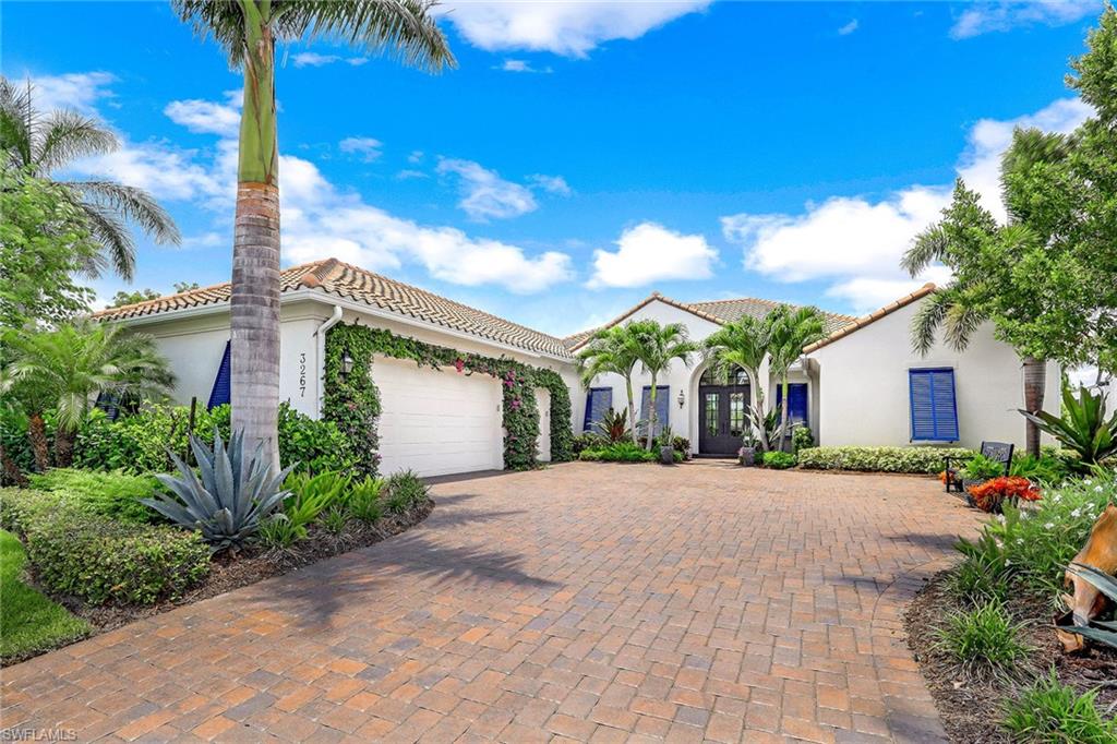 Located on a one-of-a-kind lot, this home offers a private and a peaceful golf course and lake setting. The popular Ashton Woods Tavernelle floor plan features four bedrooms plus office, four-and-a-half baths, open-concept living, ceiling with stained beams in the great room, wood-look tile flooring, French doors and impact glass. The well-equipped kitchen features Cambria® quartz countertops, a center island, shaker-style cabinetry and professional-grade JennAir stainless steel appliances with gas for cooking. Numerous upgrades include a whole-home generator, fireplace, plantation shutters, impact glass and custom outdoor kitchen. Master suite offers extensive golf course/lake views and bath with dual sinks, standalone soaking tub and shower with frameless glass door. The home features an expansive outdoor travertine deck with custom pool and spa with light-up fountains, colonnade screen enclosure and massive covered space. Located in the award-winning community of Fiddler's Creek with access to recreational and social activities, including tennis, fitness, resort-style pools, spa services, fine dining, a poolside bar and grill and multiple clubs. Sold furnished.
