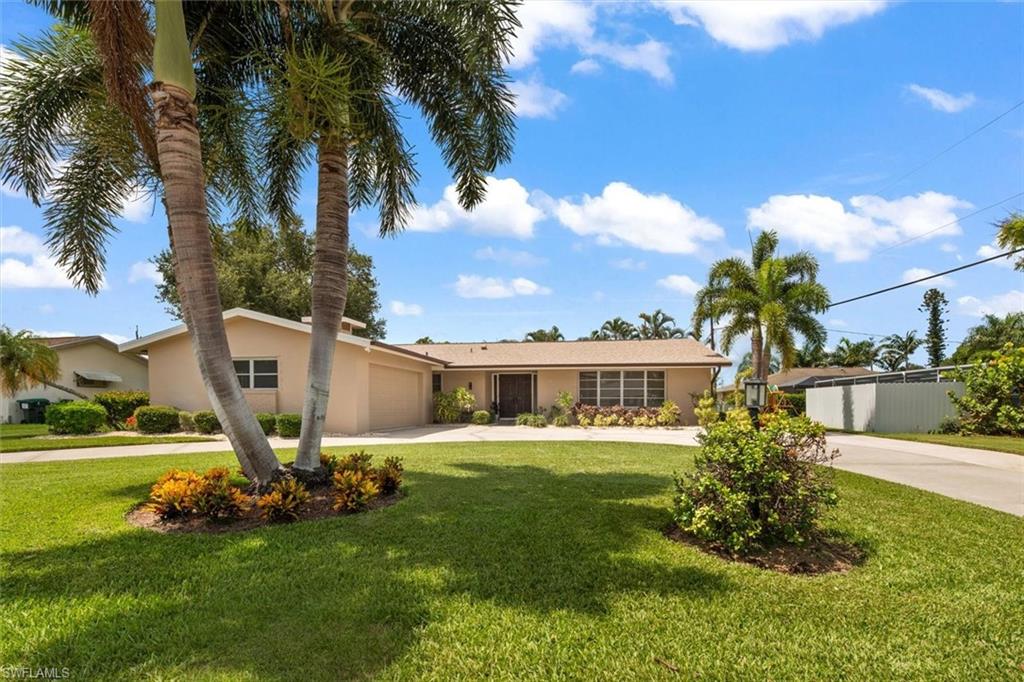 Welcome to this beautifully maintained, NO FLOOD ZONE, two-owner home in the highly desirable Tanglewood community bordering Whiskey Creek. Offering approximately 2,085 square feet, this spacious split-bedroom floor plan features luxury 9” vinyl plank flooring throughout, fresh interior paint, contemporary LED lighting, and elegant 5” baseboards. All rooms have custom window treatments- including wall and vertical blinds. 

The heart of the home is the updated kitchen with a tray ceiling, breakfast area, generous bar seating, and an open layout overlooking the expansive family room—perfect for everyday living and entertaining. A formal dining room and inviting foyer provide additional gathering space, while the functional brick fireplace adds warmth and character on cooler Florida evenings.

The primary suite offers a large walk-in closet, and both bathrooms have been tastefully updated with Kohler toilets. Step outside to enjoy the newly screened lanai with a bronze locking security door, overlooking the private fenced backyard with plenty of room to add a pool or spa.

Recent improvements provide peace of mind, including a 2022 roof with third nail, Storm Smart hurricane protection with Storm Catcher screen system, updated electrical with GFCI receptacles, 4-ton Rheem heat pump, 2023 submersible irrigation well pump, programmable thermostat, new exterior lighting, matte stainless, irrigation system with Hunter X-Core controller, and a spacious oversized garage featuring an epoxy floor and utility sink.

Located in a quiet, established neighborhood with convenient access to shopping, dining, beaches, downtown Fort Myers, and Southwest Florida International Airport. While Tanglewood does not have its own golf course, optional membership to Whiskey Creek Country Club offers golf, social amenities, and golf cart access for an additional membership fee.

The oversized circular driveway provides ample parking for multiple vehicles while enhancing the home’s curb appeal.

Move-in ready and meticulously maintained, this home combines timeless quality, thoughtful updates, and an unbeatable location.