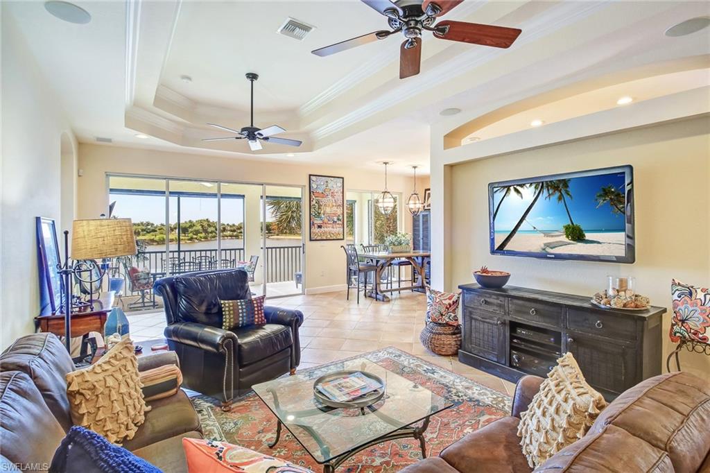 SKIP THE WAIST-LIST! Golf membership to the prestigious 27 hole Gordon Lewis designed championship golf course available immediately! BEST CENTER LAKE VIEWS available within Paloma. Enjoy the most breathtaking sunsets from the comfort of your private lanai. This meticulously kept, and completely move-in-ready spacious condo offers fantastic features such as customized tile, upgraded granite countertops and cabinets, custom kitchen back-splash, water softener, new lighting fixtures, double tray ceilings with crown molding, surround sound speakers, and a frameless master bath shower. Nestled in a great location within Bonita Springs, Palmira Country Club is a well manicured and amenity rich gated community centrally located close to shopping, entertainment, restaurants and beach access. Residents have access to the lovely Renaissance Center complete with a lagoon-style pool, olympic sized lap pool, spa, restaurant, and well equipped fitness center. Palmira also offers a 41,000-square-foot clubhouse, formal dining, grillroom, pro shop, billiards, active social and tennis/pickleball program and a Gordon Lewis designed 27-hole championship golf course. Schedule your private tour today!