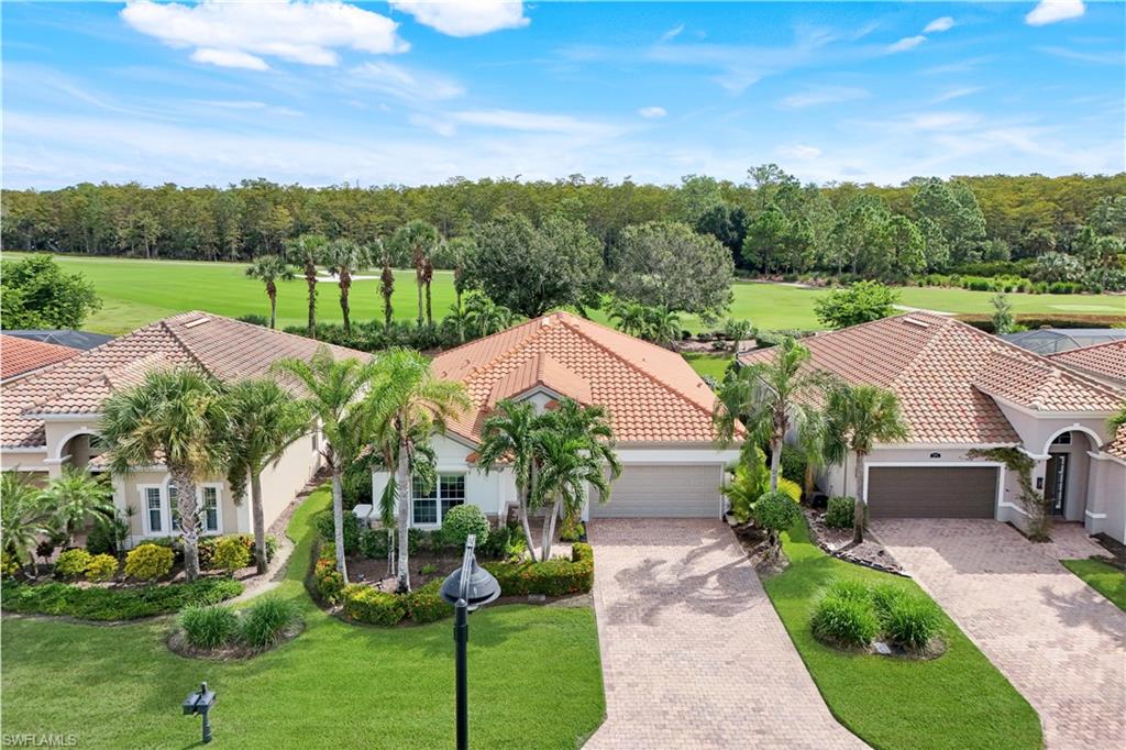 One or more photo(s) has been virtually staged, AI generated or rendered.  PRICE IMPROVEMENT ALERT:  HIGHLY MOTIVATED SELLER AND OPEN TO ALL REASONABLE OFFERS.    The views from this gem in Naples’ Quarry is pure wow! Picture yourself in a stunning two-bed, two-bath with a den that’s basically a flex space for whatever you crave. Every inch is pure luxury: freshly painted inside and out, sleek upgraded cabinets, newer appliances, gleaming floors, elegant crown molding, chic lighting, a killer sound system, an insulated garage for your toys and a Generac 20K watt automatic standby generator. The extended lanai equipped with electric storm screens so you can sip wine through any weather, gazing at stunning views of the seventh fairway and pristine preserve. Oh, and there’s room for YOUR dream pool! The Quarry's got everything for that ultimate Naples vibe with over five hundred acres of lakes for boating, jet-skiing, wakeboarding, or just chilling on a paddleboard. There's a resort-style beach club with a private sandy shore, perfect for picnics. There is tennis, pickleball, bocce ball, plus a tiki bar and indoor/outdoor restaurant with poolside service-grab a cocktail without moving. Fitness center, lap pool, walking paths through preserves, and an activities director keeps things buzzing with events. It's living in a gated resort, right in your backyard. Various optional memberships are offered at the privately owned Quarry Golf Club.  Designed by world-renowned architectural team of Dr. Michael Hurdzan and Dana Fry in 2007, this Championship golf course wraps around the water with eighteen holes of pure scenic bliss.  It’s not a home-it’s your VIP Naples escape!
