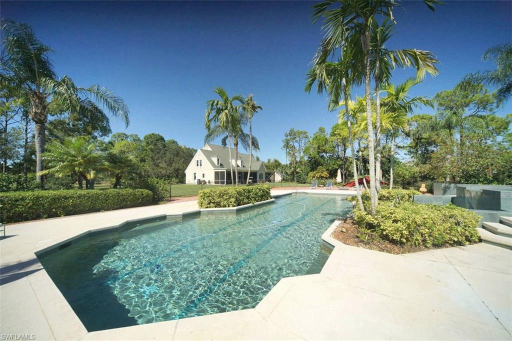 French Country Designed Estate on over 7 acres!   Perfect for entertainment; with the beautiful large pool, basketball court, and tree house. Home features 5+bedrooms, 4 1/2 baths, large office, 2 laundry rooms, den and a beautiful open concept great room.  Over 5,000sqft of living area!  2 stories, and a loft above the 2nd story bedroom, perfect for a playroom or an artist room! New flooring, 2 lanais, one with outdoor kitchen and eating areas, and the other off the master suite. The property is irrigated and planted with a wide variety of vegetation and fruit trees. Completely secure and fenced with an electric gate and call button. Two other secure entrances allow access by larger vehicles. Enjoy the scent of gardenias, jasmine and rosemary as you stroll around your own piece of Paradise. Plenty of room for horses, gardens, outbuildings, or a guest house. These large estates are few and far between this close in.   Only 10 minutes from Naples Pier, 5th Avenue Restaurants and Shopping.  Come live in the best of both worlds-convenience and spaciousness.  Don't wait, schedule your showing today!