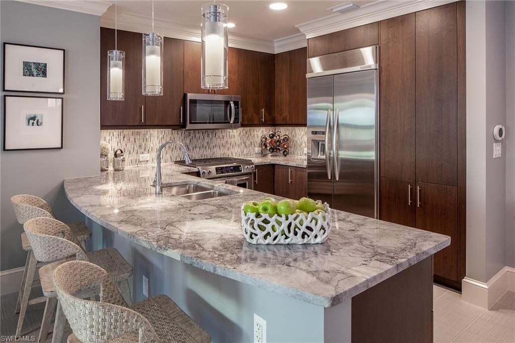 Perfectly placed on the amenities level and overlooking the bustling streets of Mercato! Meticulously maintained, with up-to-date 12 x 24-inch tile floors, window treatments, and generously sized custom closets. Open kitchen concept, with top-of-the-line stainless steel appliances, breakfast bar, and gorgeous marbled grey granite countertops. The Master suite includes a sizable luxurious shower, dual sinks, and deep soaking tub. Five Star, resort-style amenities comprised of a social room with billiards, fire pit, and grilling area, 52-foot rooftop lap pool with hydrotherapy spa, state-of-the-art fitness center, and dog walking area. Enjoy an uptown address with a walkable cosmopolitan lifestyle. Close proximity to the beach at Vanderbilt.