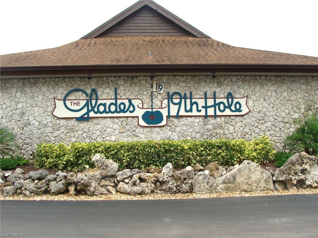 Turn Key, 2 bedroom/ 2 bath, 2nd floor condo in The Glades Country Club. All Impact Windows and Doors, short walk to clubhouse and golf course. Extremely well maintained, large condo at over 1,500 square feet under air. Screened lanai with access from both bedrooms. Very bright condo with numerous impact windows in kitchen and dining room. One of the lowest priced condos in The Glades. Very reasonable HOA fees that include golf and all amenities. Beautiful golf course included with HOA fee, plus restaurant and lounge, clay tennis courts, Bocce, community pool, putting green, and activities. The Glades is extremely close to downtown Naples, 5th Ave, Beaches, US 41, Publix, restaurants, etc.