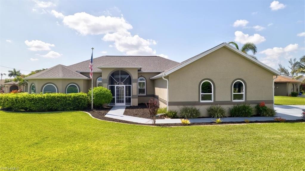 Welcome to this beautifully maintained 3-bedroom, 2-bath home, ideally located in one of the most desirable neighborhoods in SE Cape Coral, just minutes from both bridges and vibrant downtown Cape Coral. This prime location offers unmatched convenience while still providing a peaceful residential setting. Lovingly cared for by its original owners since it was built in 2006, this home radiates pride of ownership at every turn. Every detail has been thoughtfully maintained, upgraded, and impeccably cared for over the years. Situated on a desirable corner lot, the property offers exceptional curb appeal with newly enhanced landscaping, decorative curbing around the landscape beds, and a beautifully maintained exterior that reflects years of attentive stewardship. For added peace of mind, the home features impact-resistant windows, accordion shutters, and has never experienced flooding during hurricanes. Step inside to discover a bright, inviting floor plan featuring beautiful window treatments, spacious living areas, and tasteful finishes that create a warm and comfortable atmosphere. This home is being offered fully furnished, making it truly move-in ready for its fortunate new owners. The oversized 3-car garage has been thoughtfully extended to accommodate larger vehicles, including pickup trucks—providing exceptional storage and parking flexibility rarely found in similar homes. Outside, you’ll appreciate the beautifully landscaped yard and the highlight of the property—an extra-large screened lanai overlooking a tranquil canal view. This inviting outdoor living space is perfect for entertaining guests, relaxing with a good book, or enjoying your morning coffee while taking in the peaceful waterfront setting. This home has been meticulously maintained, beautifully appointed, and lovingly enjoyed by owners who are now ready to downsize. Opportunities like this are rare—a home that combines quality construction, thoughtful upgrades, storm preparedness, exceptional maintenance, and true move-in-ready convenience in one remarkable package. Whether you're looking for a full-time residence, seasonal retreat, or investment opportunity, this stunning property is ready for you to start making memories from day one. Don’t miss your chance to own this truly special home that stands out from the rest and exemplifies Florida living at its finest.