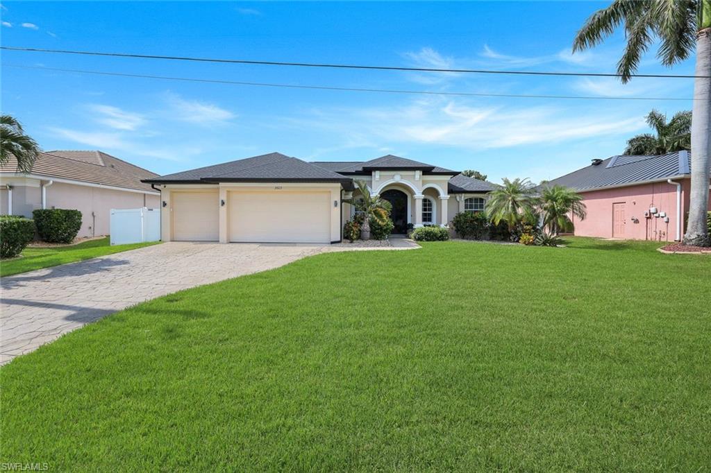 Welcome to 2603 SW 52nd Terrace, a beautifully renovated pool home located in one of Cape Coral's most desirable neighborhoods, just moments from Sands Park, shopping, dining, and local conveniences. Offering 3 bedrooms, 2 bathrooms, a split-bedroom floor plan, and an oversized 3-car garage, this home is the perfect fit for a growing family, seasonal resident, or investor seeking a rental opportunity.

From the moment you arrive, you'll appreciate the extensive updates completed throughout the property. The home features a brand-new roof, new pool pump motor, new front door, fresh interior and exterior paint, all-new landscaping, water heater, a new fence, updated sprinkler system, updated lighting and ceiling fans, and gorgeous tile flooring throughout. The fully remodeled kitchen serves as the heart of the home with new cabinetry, beautiful countertops, a stylish range hood, all-new Bosch appliances, a new sink and faucet, and a custom pantry offering additional cabinetry and shelving for exceptional storage. The master closet has beautiful custom cabinets providing an ample amount of storage for clothes and shoes! 

The laundry room has also been thoughtfully updated with new flooring, cabinetry, tile, lighting, and a new washer and dryer, creating a functional and attractive space for everyday living.

Step outside to enjoy Florida living at its finest. The spacious backyard offers plenty of room for entertaining, outdoor activities, pets, or future enhancements. Relax by the electrically heated pool, host gatherings around the new outdoor grill, or unwind beneath the beautiful shiplap-covered lanai ceiling. The home's desirable northern rear exposure provides comfortable outdoor enjoyment throughout the day.

For added peace of mind, the property experienced no flooding during recent storms. The sellers are also completing a few final cosmetic improvements, including refreshing the pool tile & lanai floor paint and updating select bathroom hardware, paint in guest bathroom, new mirrors and fixtures in both bathrooms, making this home even more move-in ready for its next owner.

Whether you're searching for a full-time residence, seasonal retreat, or income-producing investment property, this extensively updated Cape Coral home checks all the boxes. Schedule your private showing today!