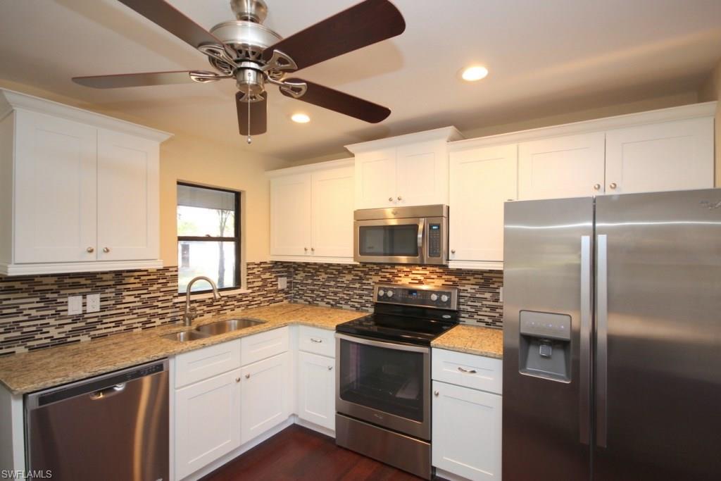 THIS IS IT!! This home is completely remodeled, with high-end finishes throughout. Located on a huge, private lot, this 2 bed 2 bath home is beyond gorgeous. Living areas have engineered bamboo floors, bedrooms have brand new carpeting with thick padding. The kitchen is straight out of a magazine, with modern white shaker cabinets, gleaming granite counters, and mosaic backsplash. There's also a moveable butcher block island and brand new stainless appliances. Both bathrooms have been tastefully remodeled as well. The roof was replaced in 2004, and the yard... This lot is HUGE, and has a fantastic tree in back. There is also a large shed for storage. AC was replaced 5 months ago, brand new sump pump, and water conditioning system was replaced less than 3 years ago. This is a move-in ready, single family home for $150,000...these deals are going away. San Carlos Park is so centrally located, with tons of shopping, dining, schools, places of worship, and just a short drive to the beach. Call today for your private showing!