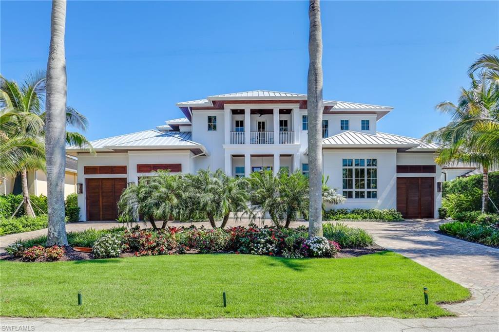 Spectacular newly constructed direct Gulf-access waterfront estate in the heart of Olde Naples. This move in ready one-of-a-kind residence is a showcase of timeless sophistication with an Olde Florida twist and designer touches throughout. Situated only one block from Third Street South with superb dining and shopping options and a stone’s throw from the soft sandy beach and tranquil Gulf waters. Enjoy direct Gulf access from your dock via Naples Bay. This open airy floor plan offers plenty of room to entertain. Elevator with stops at garage and both living levels. Upper lever VIP master suite offers king-size accommodations, and all guest bedrooms have en suite baths. The kitchen with Sub-Zero/Wolf/Miele appliances, quartz countertops, gas range is certainly chef worthy. Enjoy the true Florida lifestyle with the wonderful outdoor set-up complete with a saltwater pool and spa, outdoor kitchen, fireplace, and enclosed shower. Boaters will appreciate the new seawall including an 83 IPE dock and 20k pd boat lift. The home is equipped with Sonos and security camera systems. Look no further—you have just found your perfect destination to have your never-ending vacation of a lifetime.