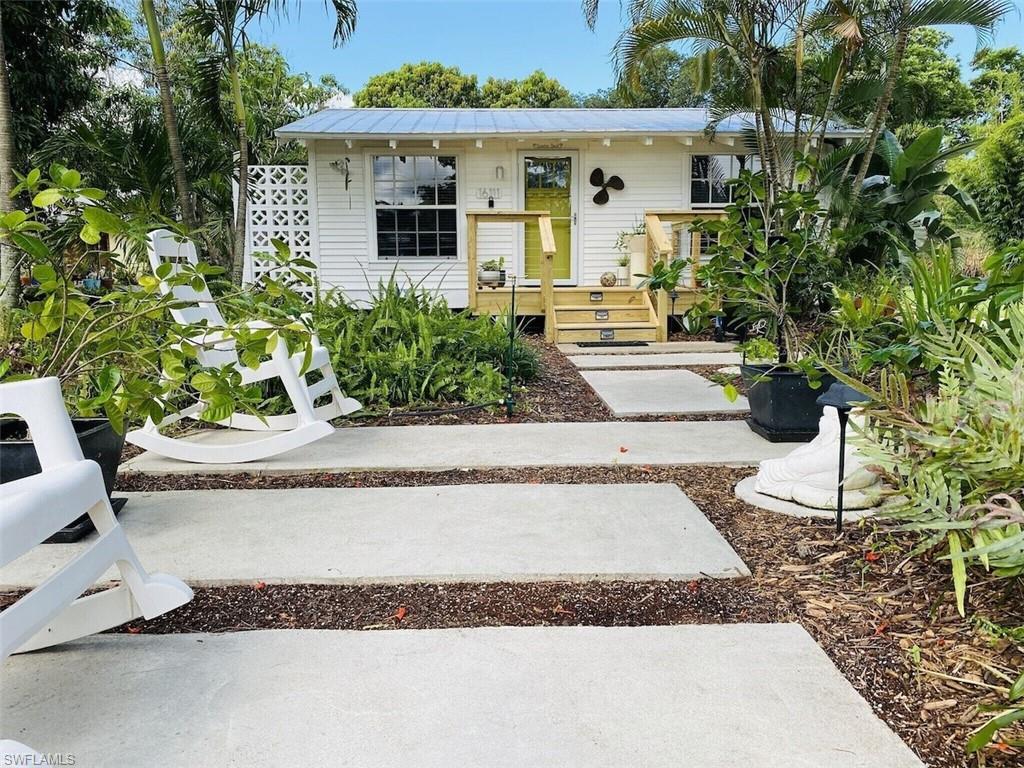 Very North end of Pine Island ... Classic Florida fishing cottage, Incredibly well maintained and the highest quality decorating. The detail is out of Architectural Digest or House Beautiful magazines !! The Owners have used the Cottage for their very successful Rental business. Furnished with a few personal exceptions. Two porches for guests enjoying the warm evening breezes. Beautifully landscaped 50 x 210 lot, at the end of the street is the quaint Jug Creek Marina... Boating, kayak, salt water fishing all on Tortuga St ... The best way to describe this property is to stop by and see it yourself..! Love at first sight .....