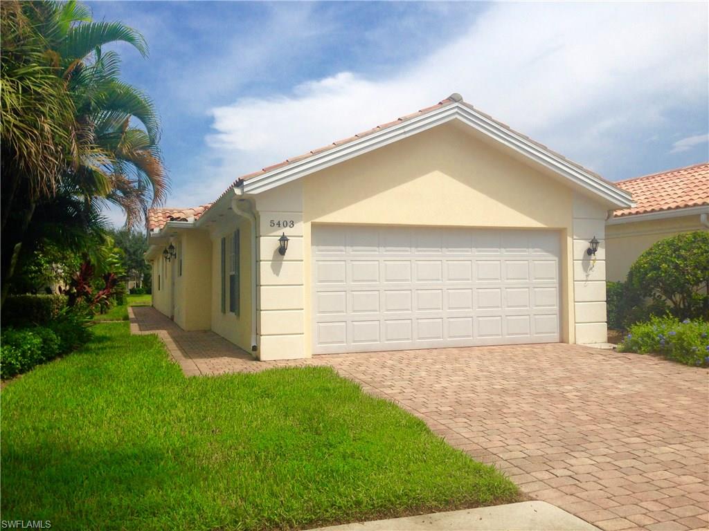 Lakefront Capri Villa with extended living area is within short WALKING distance to the pool, tennis courts, clubhouse and more! Built by Divosta, known for its steel reinforced poured concrete construction, this lovely home features a large built in shelving unit with mirrors in the family room, a large master bedroom with walk-in closet and master bath with double sinks, under cabinet lighting and a large mirrored linen closet with lots of storage space. The second bedroom which can be used as a private guest suite, also features a large walk-in closet with extra shelving.  Spacious laundry room has large storage closet as well as a utility sink and counter top. The kitchen offers and eat-in bar, pantry and lots of storage for all your cooking needs. The property has a poured keystone deck to relax on and enjoy the lake view and wildlife. Island Walk is an award winning community that offers a wide variety of amenities including tennis, swimming, fitness center, hair and nail salon, gas station, restaurant and putting green. Gated entrance has security 24 hrs. a day. Located minutes from beaches, shopping and entertainment.