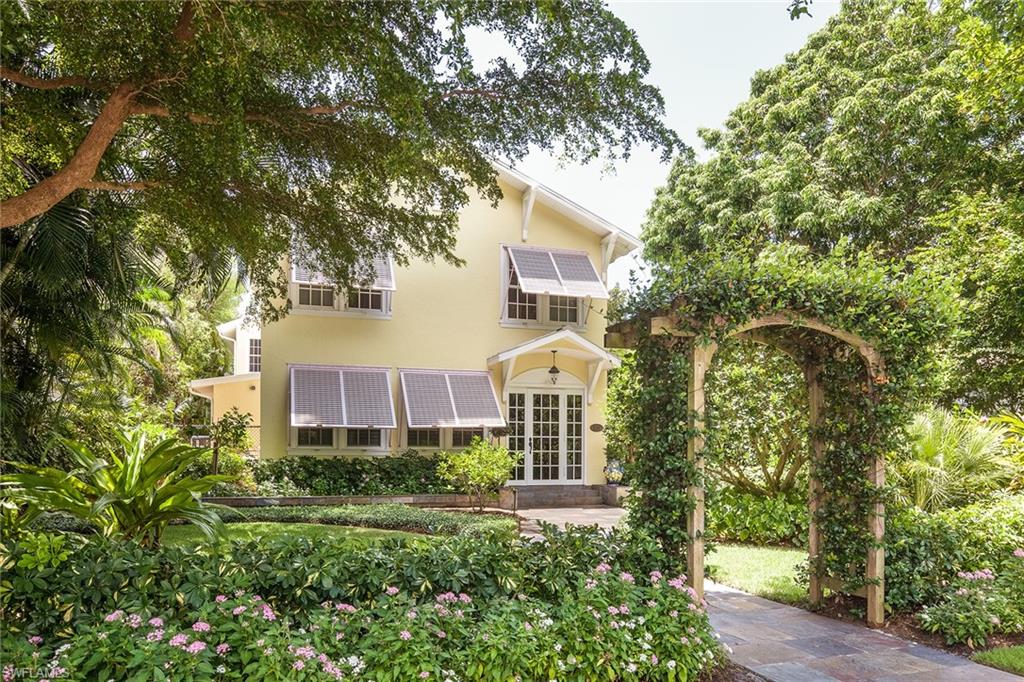 A once-in-a-lifetime opportunity to own a true Naples historic cottage only 4 homes to the beach and a short stroll to the celebrated shopping and dining district of 3rd Street South. Thoughtfully updated while maintaining the charm and character of yesteryear, including reclaimed pine floors, inset bead-board custom cabinetry and authentic soapstone countertops. The home itself is highlighted with a floor plan that affords both owners and guests the ultimate in privacy. First-floor master suite features banks of French doors that spill onto a tropical outdoor area complete with pool, spa and outdoor area with automated screens. Second-floor master includes dual baths, custom closets and easy access to a den/sitting area. Lushly landscaped and meticulously maintained with artificial turf, blooming Hibiscus trees and a flowering jasmine arbor.