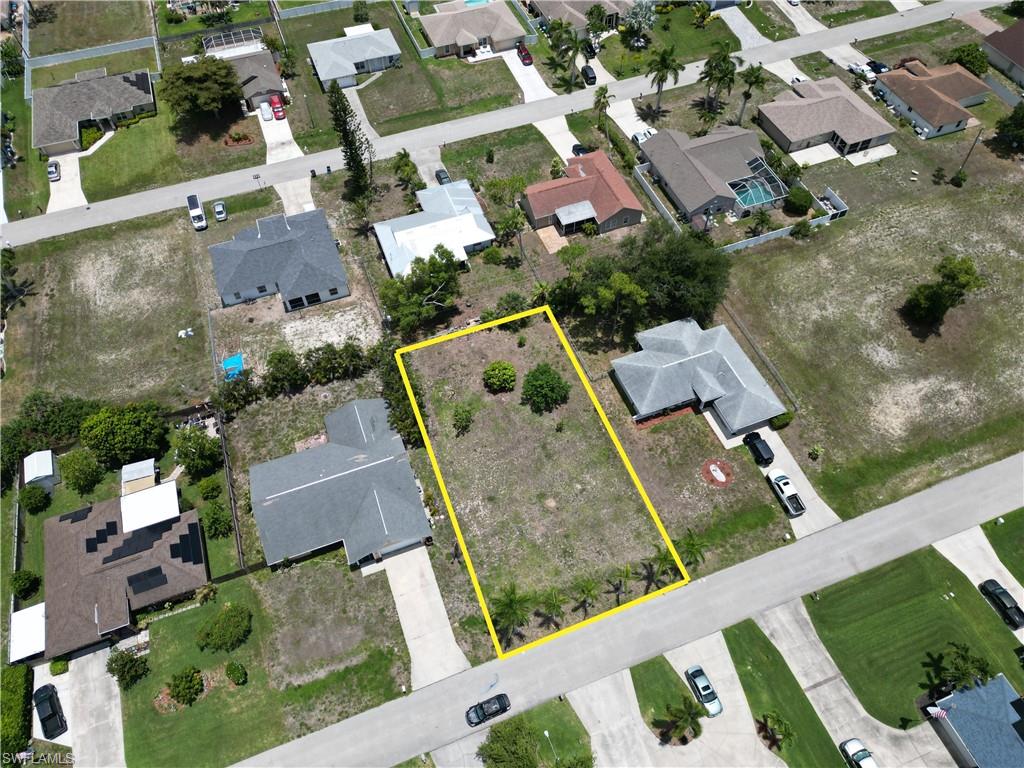 Vacant lot in the highly desirable Southwest Cape Coral! This lot features mature royal palm trees along the road, already increasing the curb appeal of your future new home. City water and sewer is PAID. Call today for details!