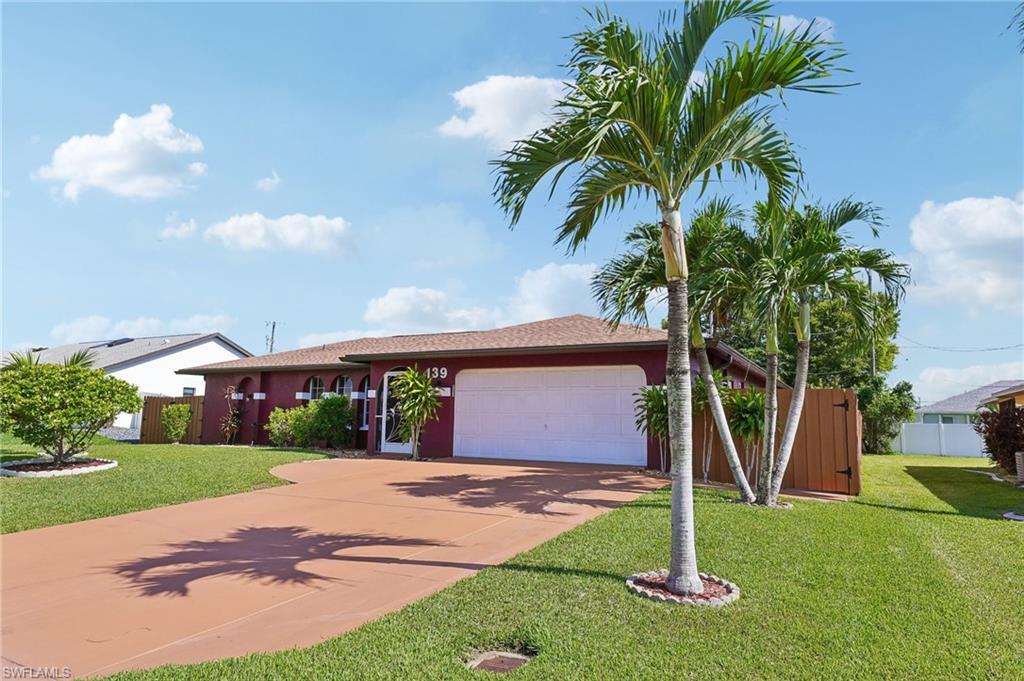 Welcome to this beautifully maintained Cape Coral pool home offering the comfort, updates, and indoor-outdoor lifestyle today’s buyers are searching for. This 3-bedroom, 2-bath home features 1,922 square feet of living space, a newer roof, updated bathrooms, an updated kitchen with granite countertops, freshly painted cabinetry, stainless steel appliances, and a thoughtful floor plan with two separate living areas.
Designed for both everyday comfort and entertaining, the home offers a more formal living and dining area, along with a spacious family room that creates additional flexibility for relaxing, hosting, or working from home. The lanai is accessible from both the dedicated dining area and the family room, and the fully retractable sliders allow the interior and outdoor living spaces to blend beautifully together.
Step outside to your private Florida retreat. The heated inground pool and spa are surrounded by a screened pool cage, brick paver deck, tanning ledge, water features, and a fully fenced backyard designed for relaxed Southwest Florida living. The guest bath also provides convenient access to the pool area, creating a desirable cabana-style setup.
The property is equally impressive for buyers who value storage, hobbies, boating, and functionality. A double-gate entry leads to a dedicated boat storage area with exterior power and water access, while the 50-amp receptacle offers generator hookup capability or added convenience for a travel trailer or RV. The 16' x 10' storage shed provides excellent flexibility and could be used as a workshop, she shed, craft room, hobby studio, garden space, or additional storage.
Inside, you’ll also find porcelain tile in key living areas, fresh interior paint, generous natural light, and a spacious laundry room with storage and a utility sink. Additional exterior features include extended walkways, extra exterior outlets, multiple water spigots, updated fencing, and well-planned outdoor maintenance access.
A 1-year home warranty is included, effective at closing, giving buyers added peace of mind. With its updated kitchen and baths, two living areas, newer roof, heated pool and spa, fenced yard, boat storage, generator-ready convenience, flexible shed space, and central Cape Coral location near shopping, dining, parks, and everyday essentials, this home delivers exceptional value and the Florida lifestyle in one compelling package.