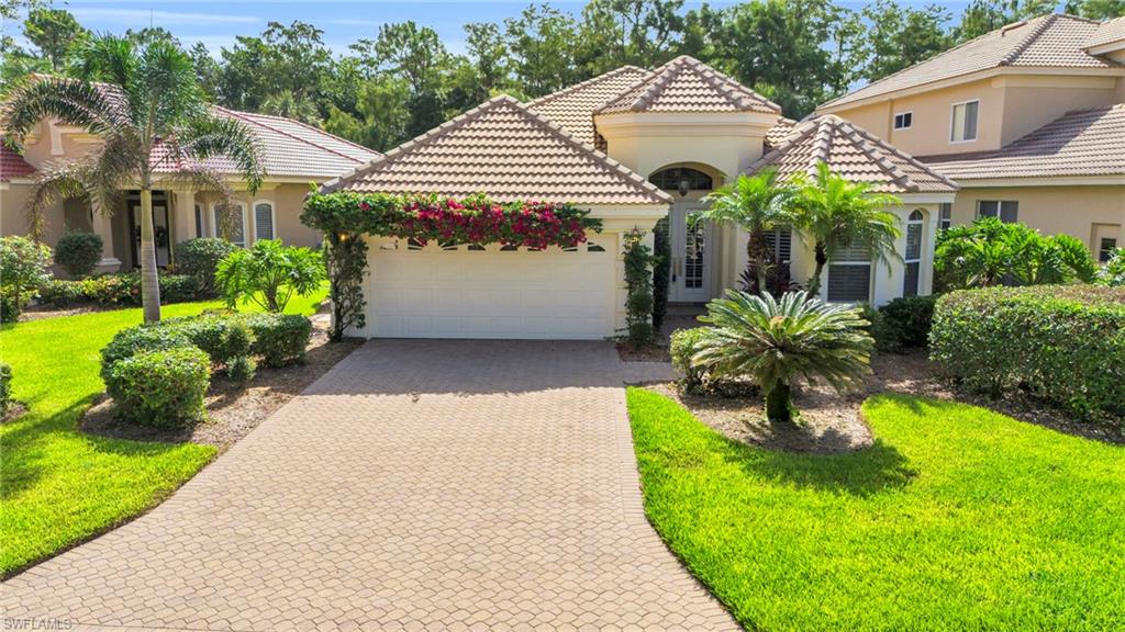 Designed for those who value quality, location, and ease, this Troon Lakes home offers an elevated North Naples lifestyle within the gates of Pelican Marsh. Featuring 2 bedrooms plus a spacious den, 2 bathrooms, and approximately 2,049 square feet, the residence showcases an open-concept design with tray ceilings, plantation shutters, tile flooring in the main living areas and bathrooms, and Kährs Scandinavian flooring in the bedrooms. The kitchen is thoughtfully appointed with Taj Mahal quartzite countertops, stainless steel appliances, and ample cabinetry. The primary suite includes an oversized bedroom, dual closets, a soaking tub, and a separate walk-in shower. A generously sized den with sliding double doors offers flexibility for a home office or additional guest room. The screened lanai provides a private, landscaped setting with a built-in spa and space to add a full pool if desired, while the Troon Lakes neighborhood pool is just steps away for convenient enjoyment without the maintenance. Recent improvements include fresh interior paint in select rooms and a new AC system installed in 2025, enhancing the home’s move-in-ready appeal. Residents enjoy Pelican Marsh’s 24-hour staffed gates, fitness center, tennis and pickleball courts, walking paths, and access to a private, world-class golf club, all minutes from Mercato, Gulf beaches, dining, and shopping. Don't miss out on this exceptional North Naples home!