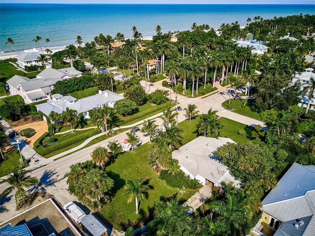 Amazing opportunity to live in the heart of Old Naples. Located on the corner of Gulf Shore Blvd and 9th Ave S, this property is just minutes from Naples Pier, Third Street S. Historic District, 5th Ave S, and so much more. If that wasn't enough, you are less than 500 ft from having your toes in the sand via the beach access at the end of 9th Ave S. Current house consists of a 3 bedroom, 2 bathroom house with an attached 1 bedroom 1.5 bath guest suite. At nearly 15,000 sq/ft of land, spanning 3 full lots of record, your options range from remodeling the current structure to starting from scratch and constructing the home of of your dreams. Unique opportunities like this do not happen often in this much sought after location. Don't wait. This property won't last long.