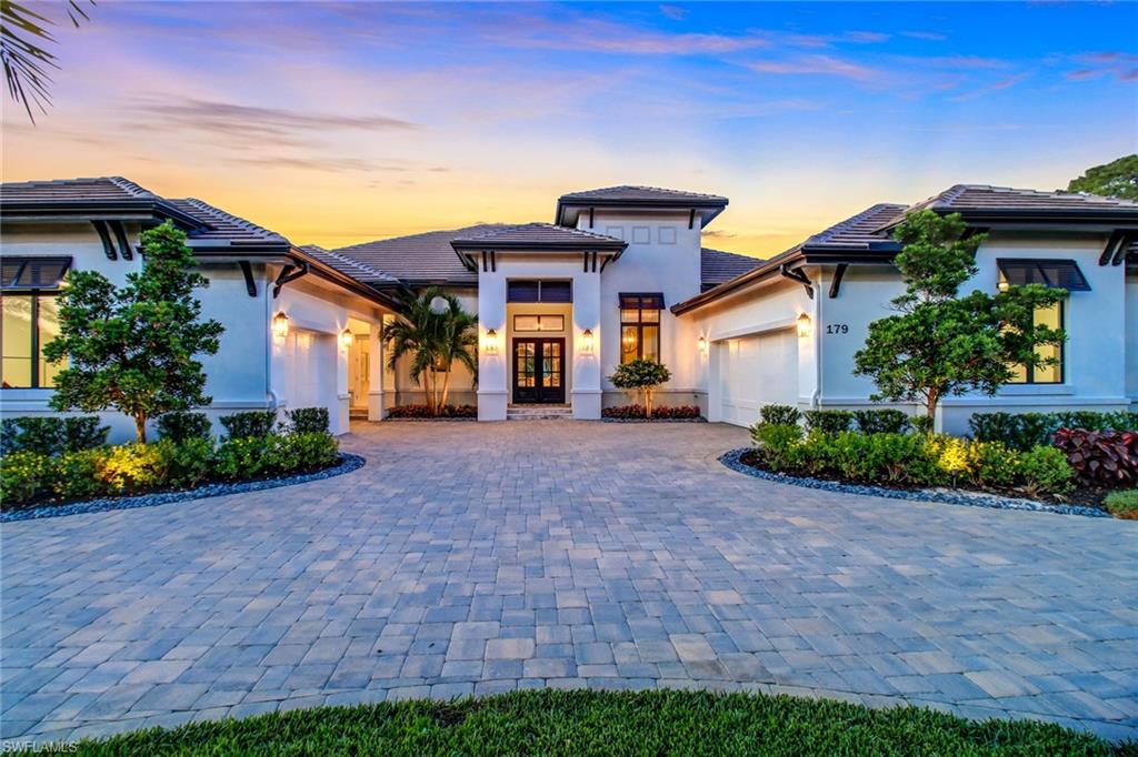One step into this luxurious oasis will leave you speechless! 179 Mahogany Dr. is an award winning, "Stock" Custom Home, elegantly perched on 1.51 acres of FENCED property with its own PRIVATE POND which includes a stunning water feature located in beautiful Pine Ridge Estates. You'll notice nothing will compete with this home as you enter through a grand foyer and observe this homes spacious open-concept floor plan, boasting 4,323 square feet of living space with only the most luxurious features. The interior of this home is nothing short of exquisite, with furnishings from SoCo Interiors, Jenn Air Appliances, formal dining room, expanded island, custom blinds, custom ceilings & crown molding. Master Bedroom includes spacious walk-in-closets and a master bathroom that will take your breath away. The study includes built-in wall cabinetry and an adjacent wet bar. Outdoor features include covered lanai, outdoor kitchen with grill & bar, motorized storm shutters, oversized salt-generating pool and raised spa, gas-raised fire feature, sun shelf & pool cage with a panoramic view. Come view this today!