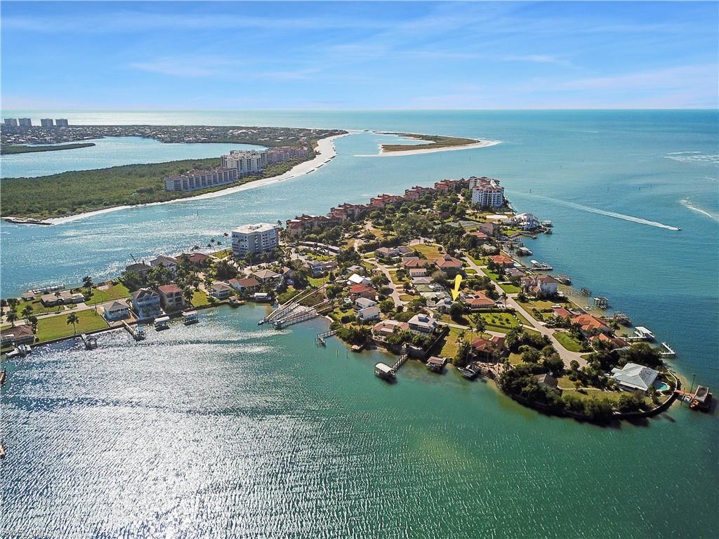 Fantastic coastal living in SWFL's Isles of Capri! Live in this Key West style bungalow year round or make it your perfect seasonal living destination spot. A new a/c unit has just been installed along with a new shingle roof. This single family home is situated on an irregular shaped lot w/ circular drive that offers rv/boat parking and an awesome view of the Gulf of Mexico. Isles of Capri is situated in S Naples and features a wonderful island feel within a non-gated, no HOA boating community. You will love the wonderful open concept living feel of this single family home that offers a cupola in great room, tile flooring throughout, lots of windows along w/ French door front entry allowing natural lighting to pour into the home, split bedroom floor plan, great room design, and a renovated kitchen w/ gorgeous granite countertops & stainless steel appliances. The property offers a detached garage and plenty of parking area. Isles of Capri, nestled along the Gulf of Mexico, is the perfect coastal community for those who love the waterways of SWFL while living in a non-gated community w/ no community fees & little restrictions.