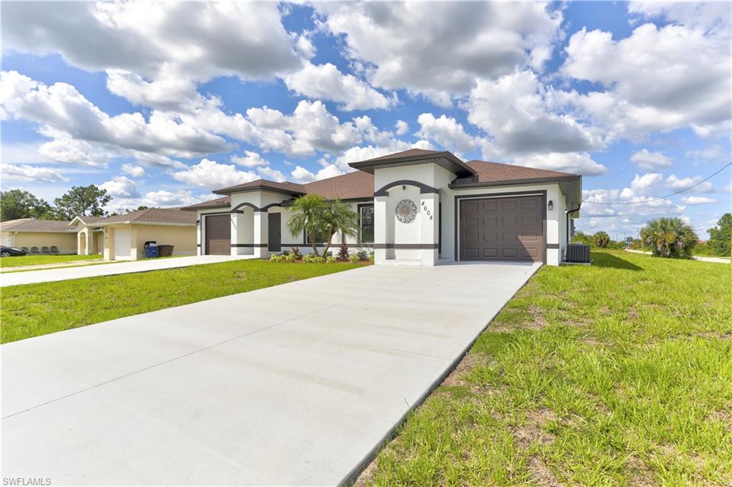 Become the fortunate owner of this excellent source of income property and take advantage of the easier pre-qualification with one of our preferred lenders offering closing costs and downpayment assistance. Unique building design of six bedrooms and four bathrooms total. 24x24 porcelain tile throughout, granite or quartz countertops, stainless steel appliances, modern light fixtures, frameless glass shower door in master bath. Great bath offers tub and shower combo, led lights, designer wood cabinetry, security system with cameras, breathtaking property for sure. Located in one of the best areas of Lehigh Acres, close to shopping centers and main roads. One of the biggest duplex in town on an oversized lot. Expected completion date by the end of December 2023.
