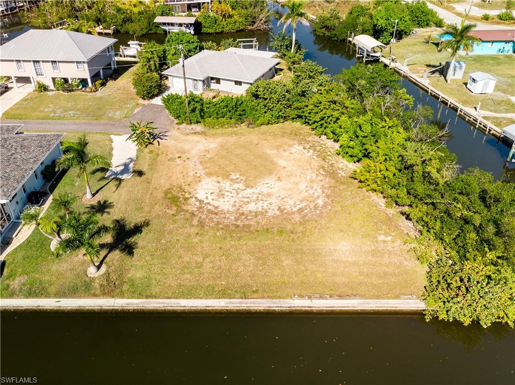 One of the few corner vacant lots with gulf access on Pine Island! Located at the South end of the Island in St. James City. Enjoy tranquil living this cleared lot is located on a private road with a dead end. It is ready  for you to build that tropical dream home you have been thinking about! Enjoy mornings watching the sun come up over the beautiful water since this lot is facing the highly desired Southern exposure view. Fishing anyone? Located on an intersecting canal with deep water access with a sea wall that will allow for many options to put in a dock and boat lift. This vacant lot has it all!! Come on out and see this amazing lot!